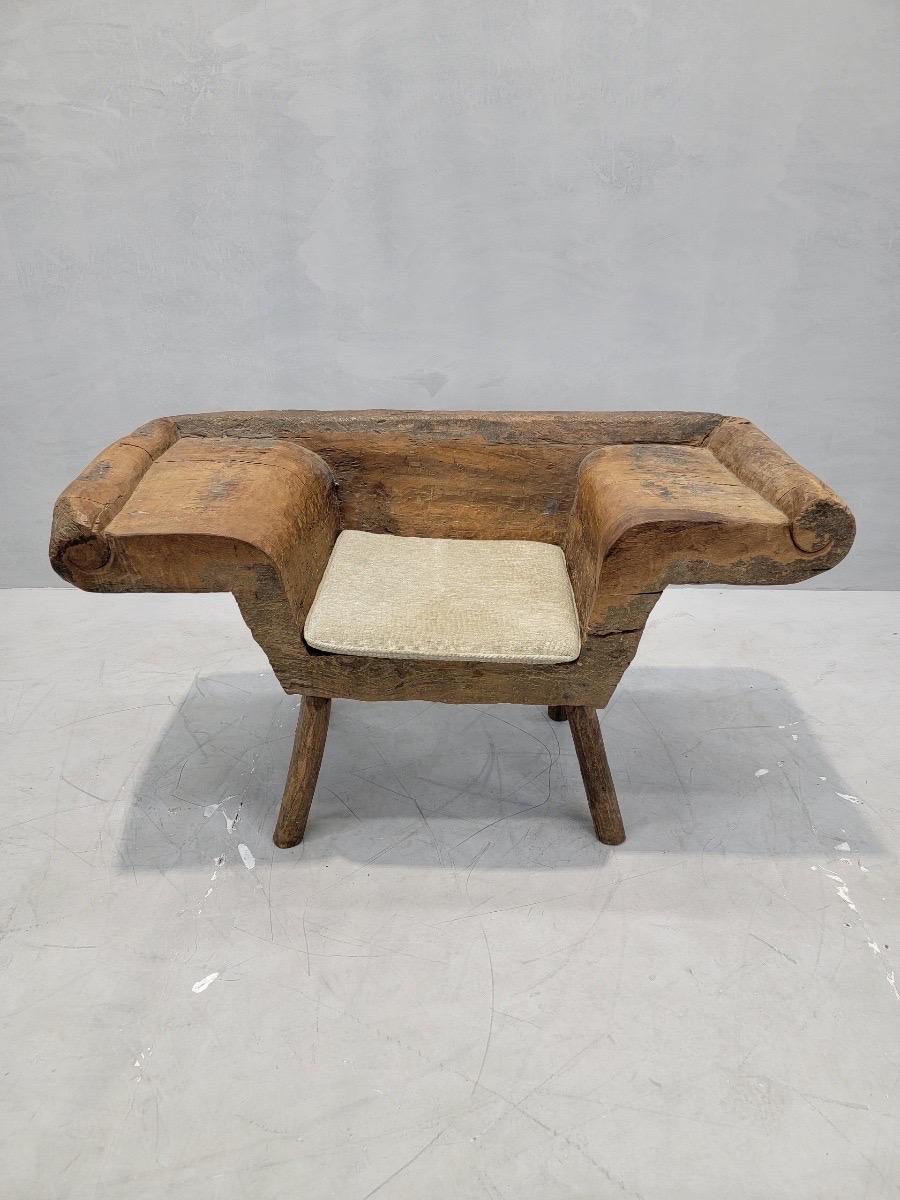 Antique Kampung Teak Root Sitting Bench

This antique South East Asian chair would be a rustic accent to your living or lounge space. The wood has a light distressed finish and wings perfect for resting a drink. The seat pillow is original. 

Circa