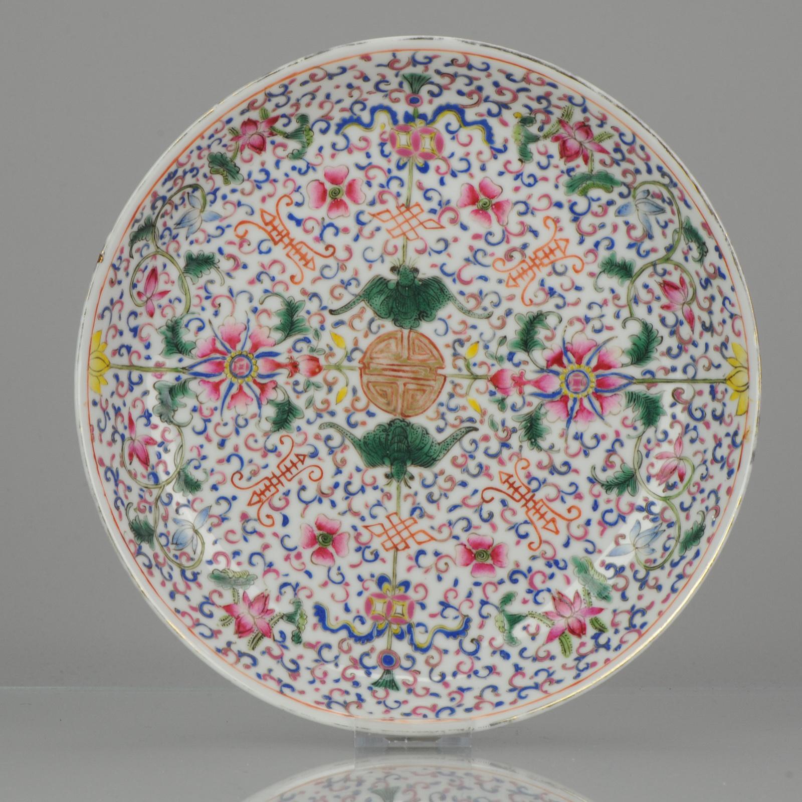 Top Quality Kangxi marked plate. Late Qing or republic.

Circular shape footed dish, hand enameled in polychrome with blooming flowers alternating with central symbol of Prosperous Longevity, surrounded by other symbols in red and by two bats. The