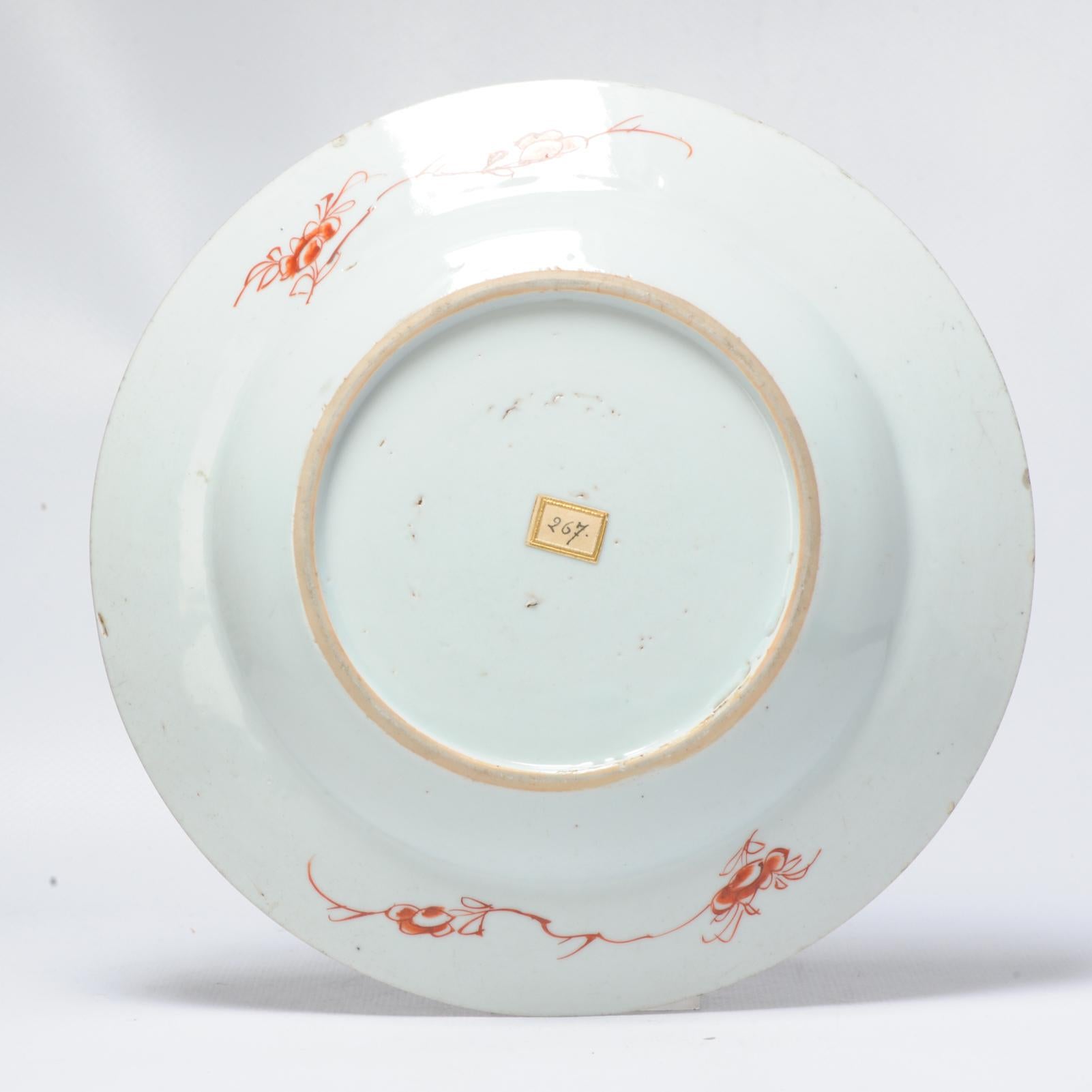 Dish on footring, flat underglaze brown-edged rim (jia mangkou). Decorated in various enamels, such as blue, iron-red, pink, turquoise and yellow in the centre with a two-handled flowerpot standing on a low tablle, filled with a pomegranate, finger