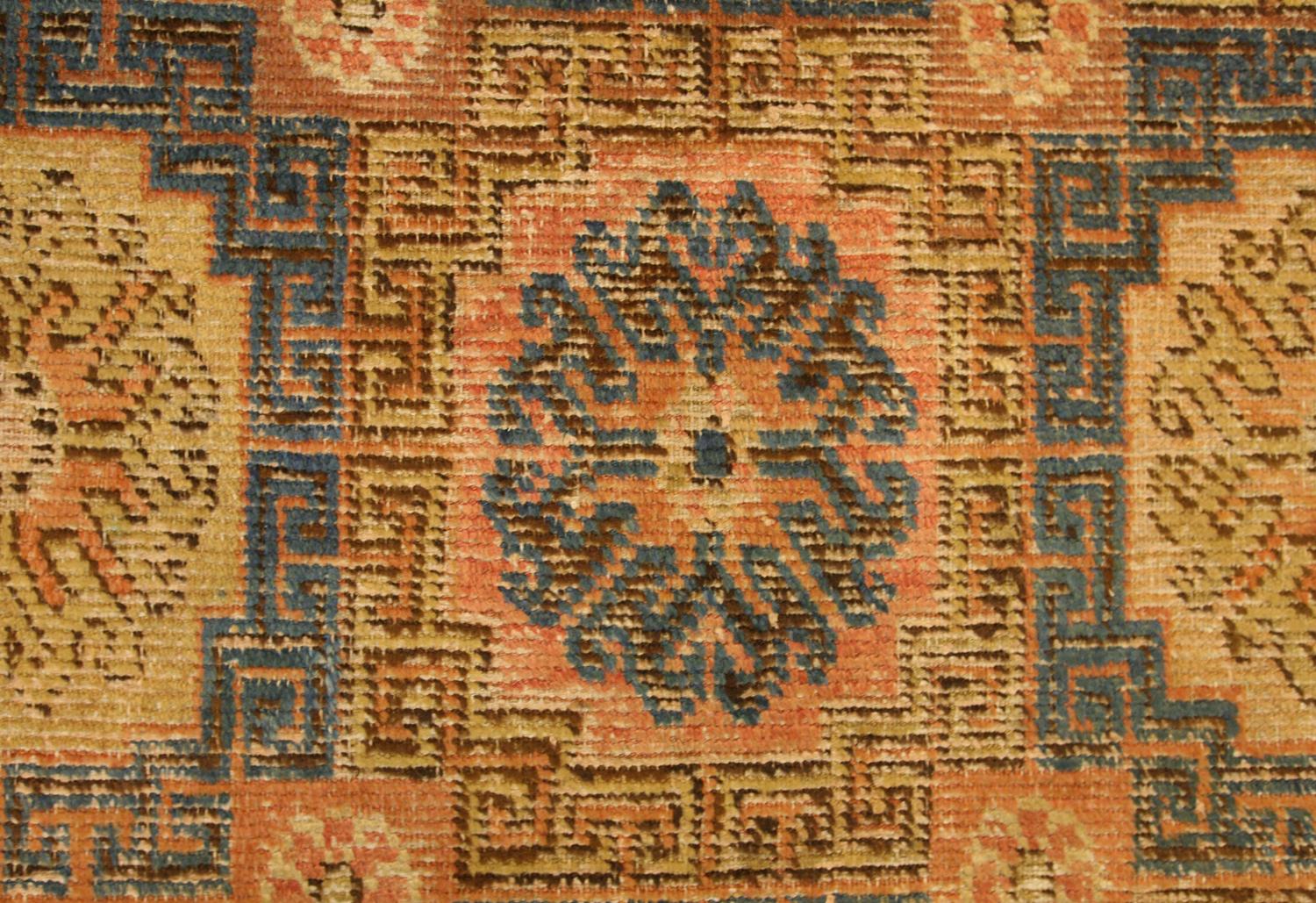 East Turkestani Antique Kansu Beige Wool Khotan Carpet, 18th Century For Sale