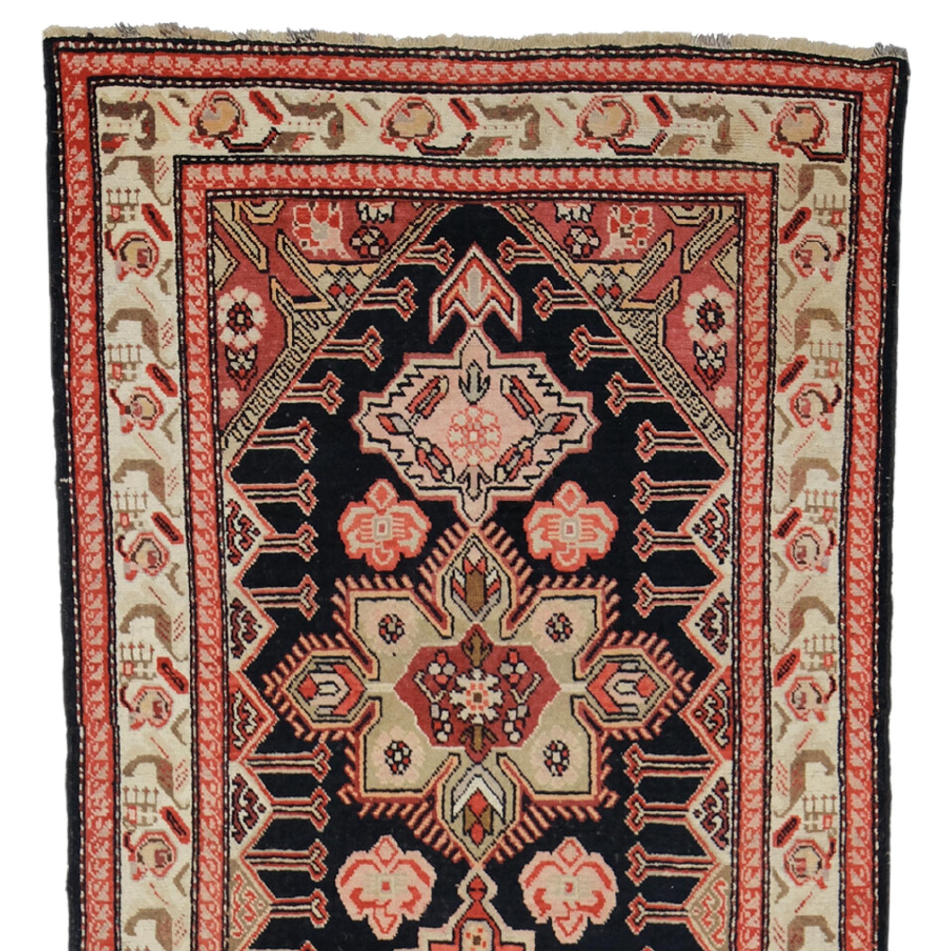 This antique Karabakh runner is a magnificent artifact that will allow you to establish a connection between art and history. This 19th-century rug is hand-woven with precision and care, with each thread telling the story of an era. With its rich