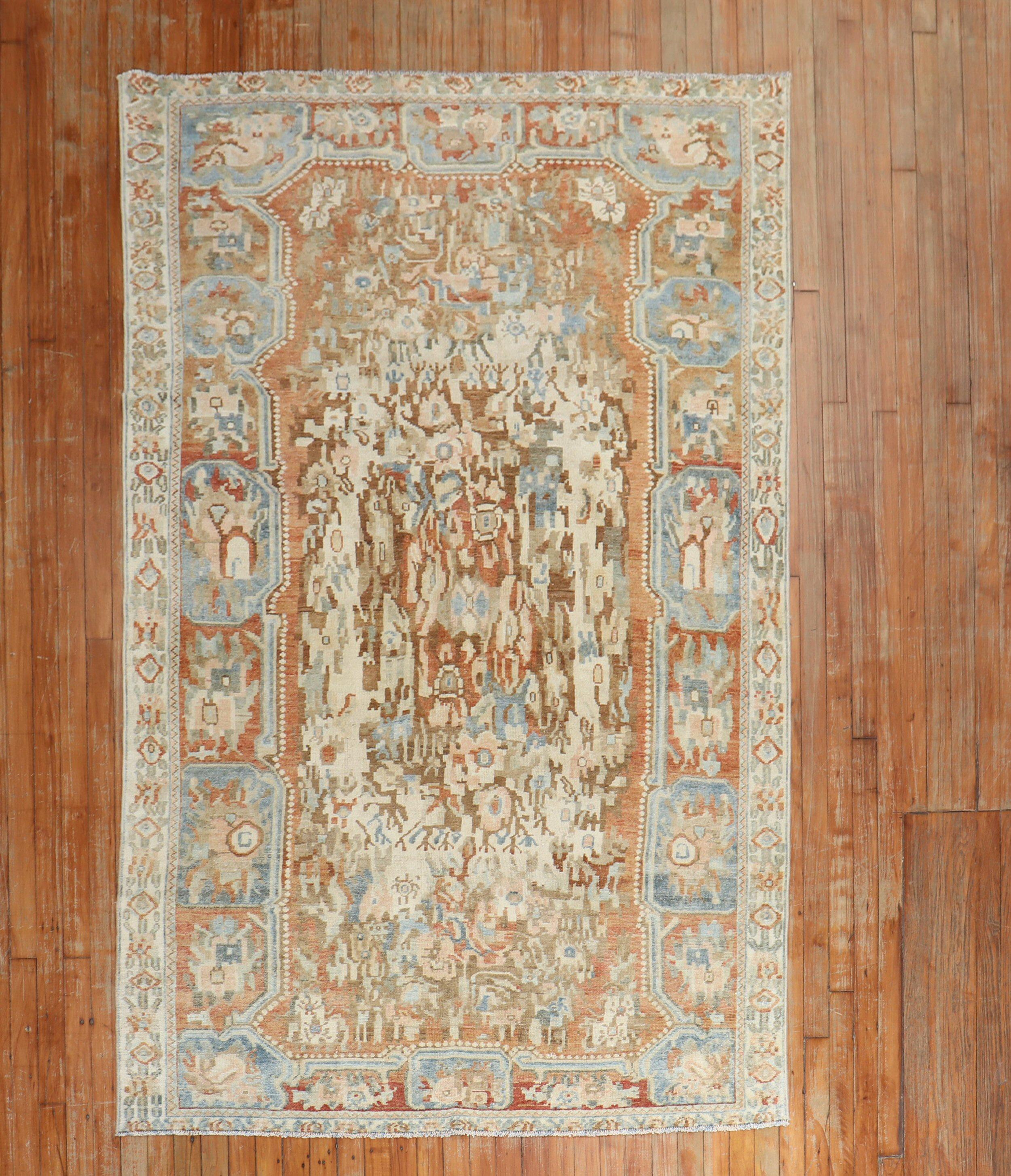 An early 20th Century Russian Karabagh rug with a floral motif in brown, ivory blue, and apricot tones

Measures: 4'9'' x 7'6''.