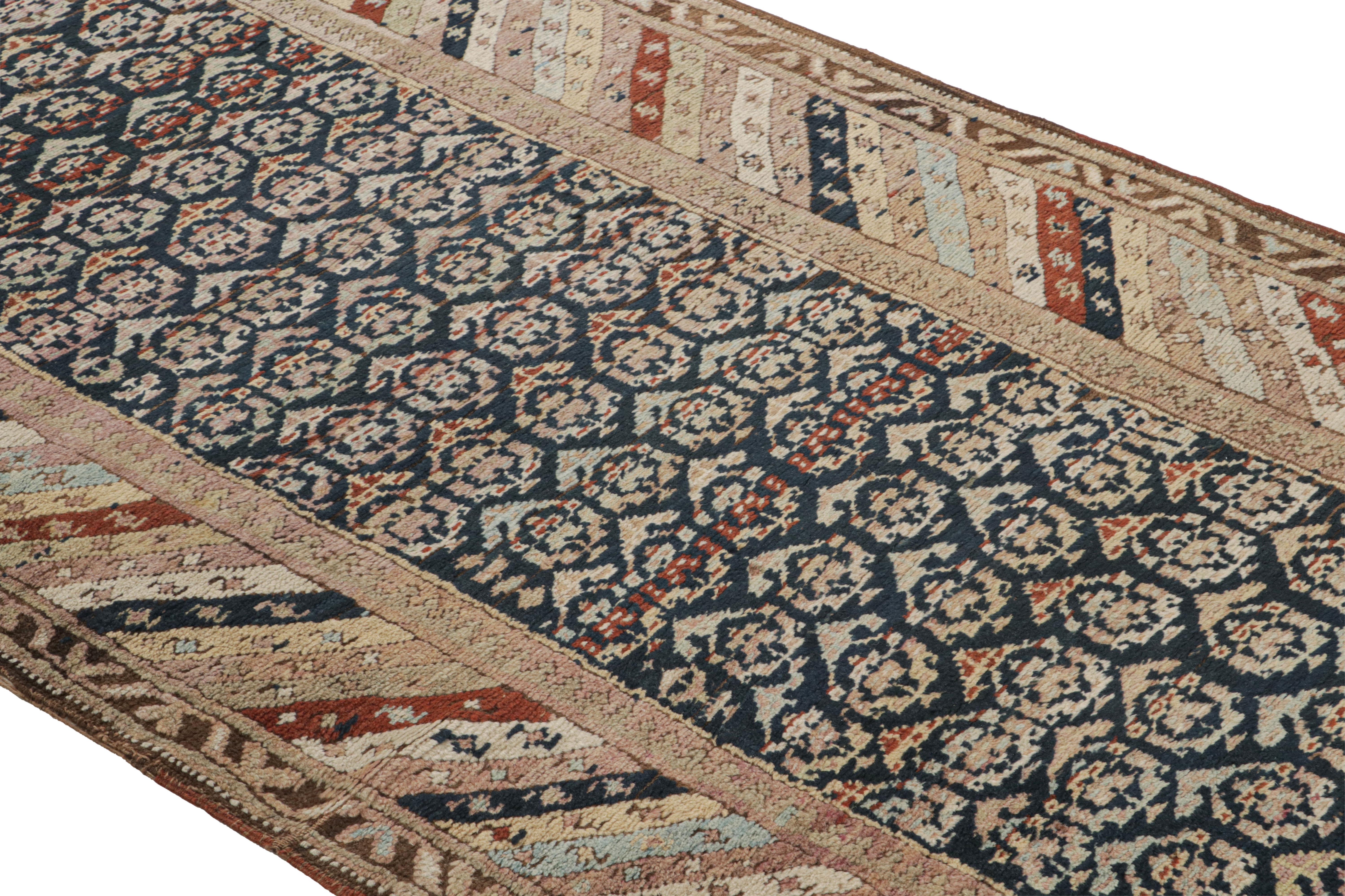 Hand knotted in wool originating from Russia circa 1890-1900, this antique runner connotes a 19th century Karabagh rug design, employing an atypical play of Classic beige-brown and black hues in portraying the Classic boteh (paisley) pattern as its