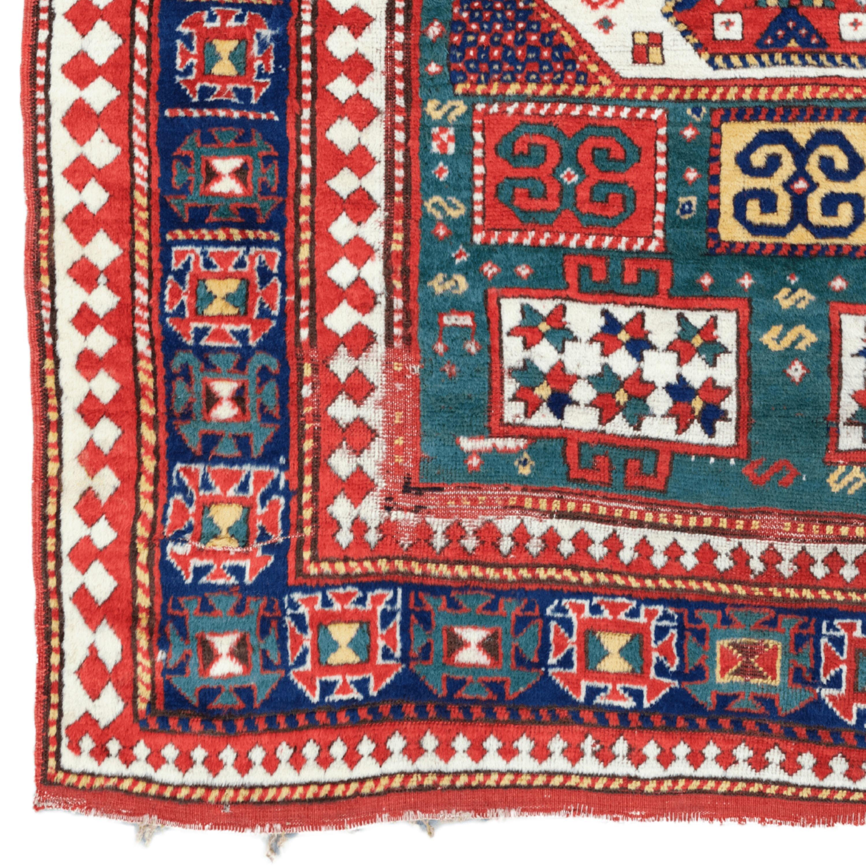 Elegance Beyond the Limit of Time: 19th Century Antique Caucasian Karachop Carpet This rare work takes you on a historical journey at every glance with its rich cultural heritage and fine workmanship. With its vibrant colors and intricate patterns,