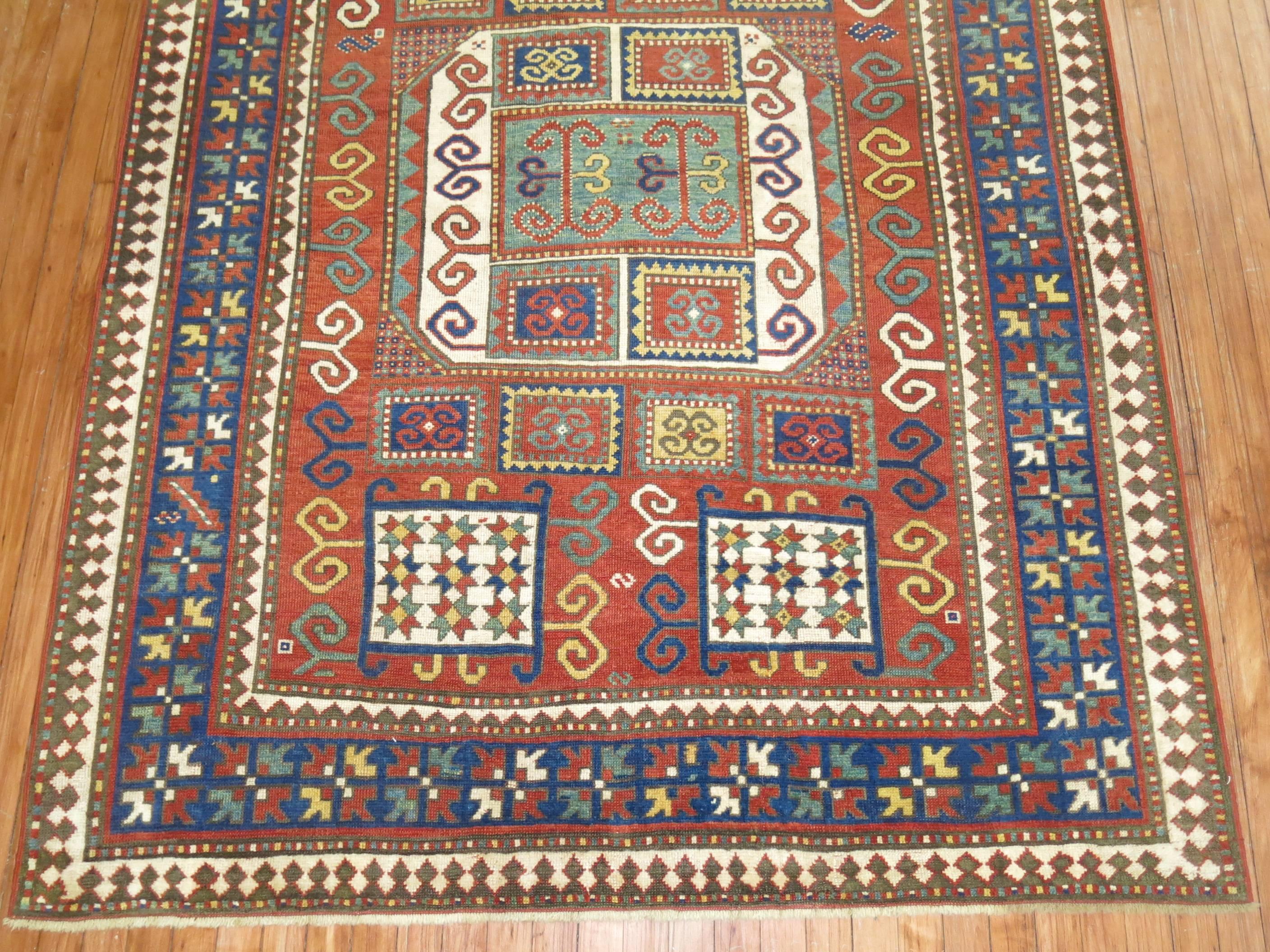 An early 20th century rare intermediate size Caucasian Karachopt Kazak rug.

Karachopt Kazaks have grown to become an icon of Caucasian village weaving. This red ground example has a number of distinguishing features, among which a soft, silky
