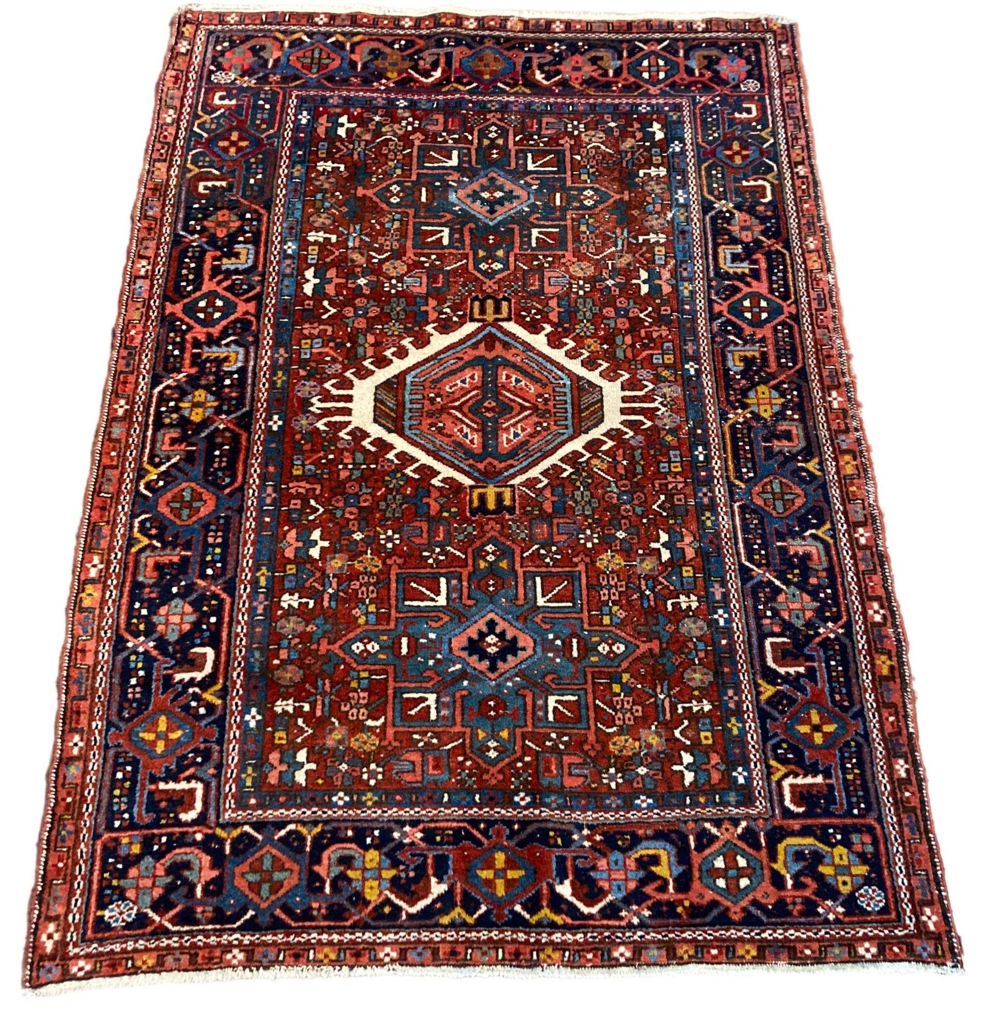 A beautiful antique Karadja rug, handwoven circa 1920 with a geometrical 3 medallion design on a terracotta field and deep indigo border. Fabulous secondary colours, especially the gold throughout the field and a highly decorative piece.
Size: 1.93m