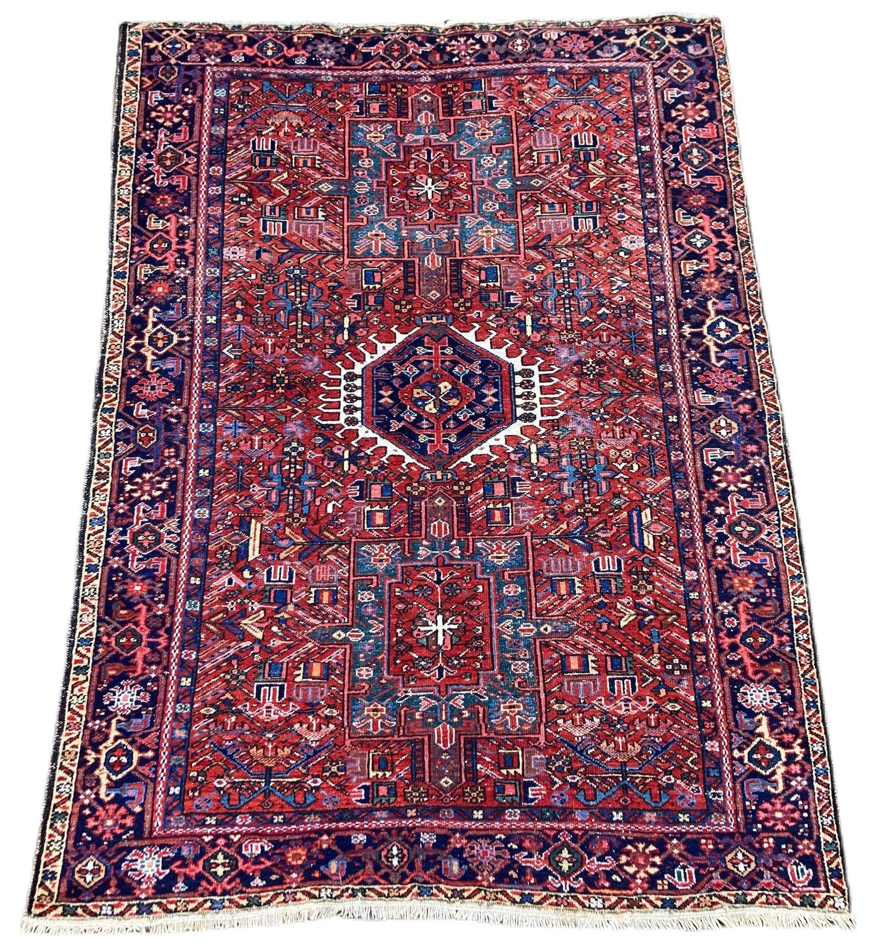 A beautiful antique Karadja rug, handwoven circa 1910 with a geometrical 3 medallion design on a terracotta field and deep indigo border. Fabulous secondary colours, especially the teal blue in the medallions and a highly decorative piece.

Size:
