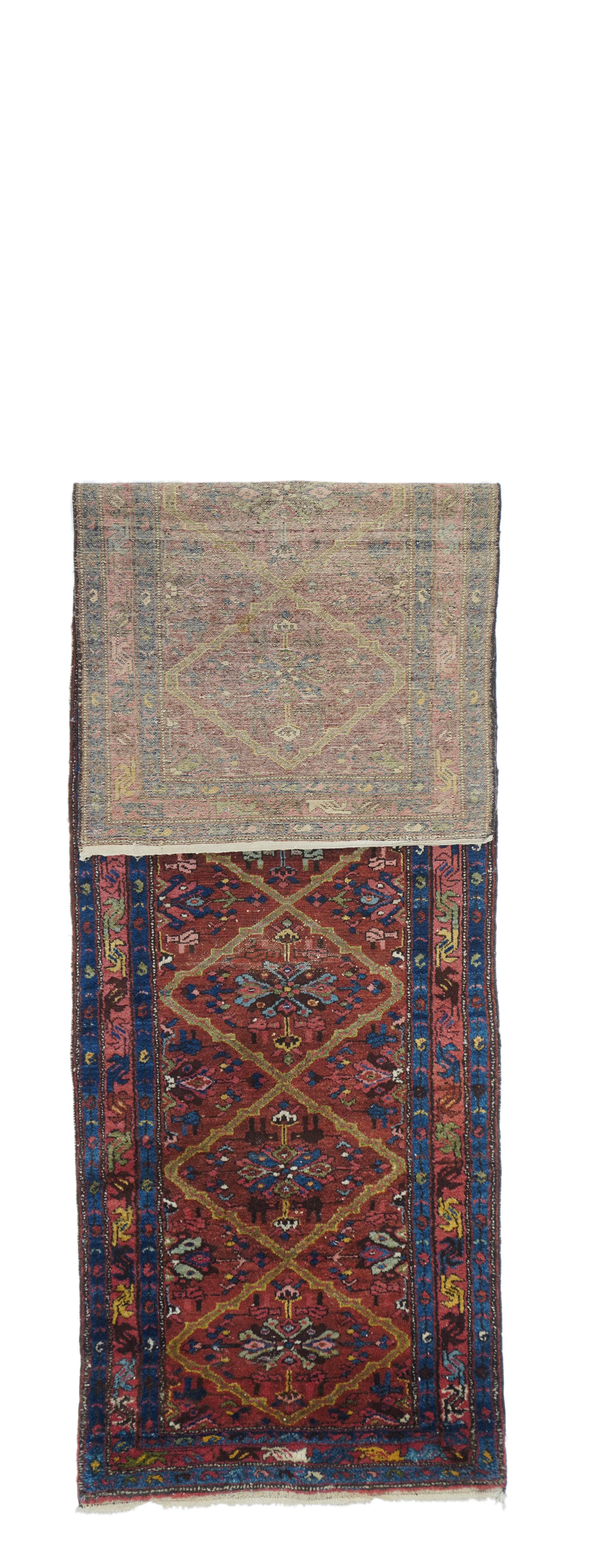 Antique Karajeh Heriz rug measures: 3'0'' x 9'7''.