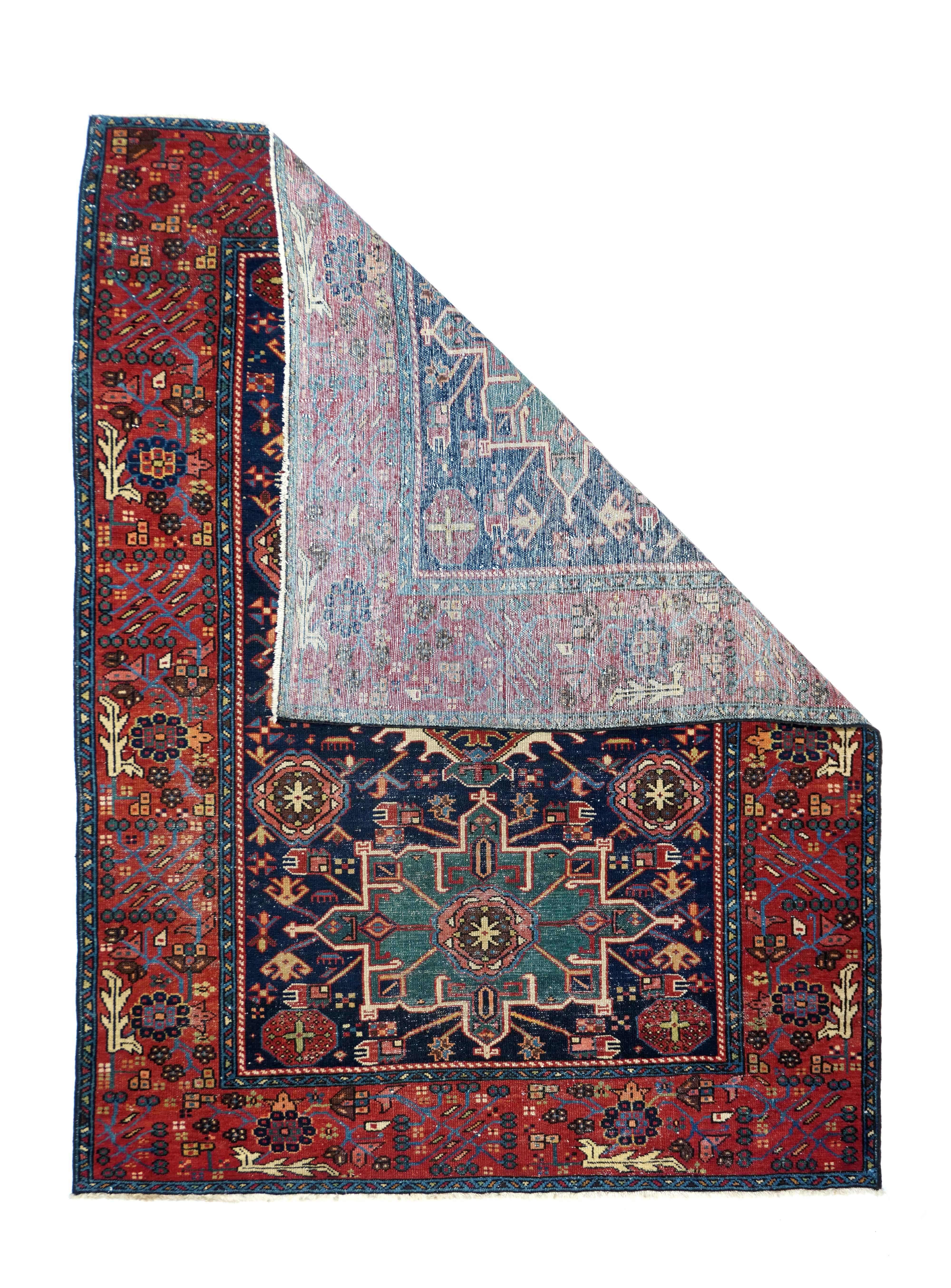 Antique Karajeh rug, measures: 4'10'' x 6'3''. The lancet leaves have shrunk on this all-Herati, all the time, well-woven scatter with a navy-black field divided into diamond-shaped reserves by a small flower trellis. Herati scalloped ecru