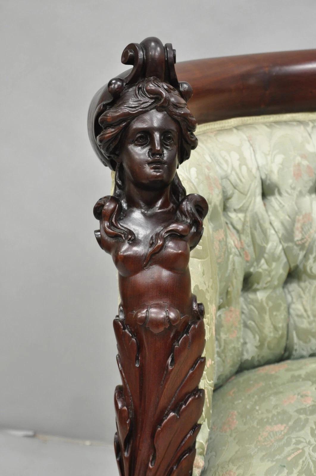 Antique Victorian Rococo Figural Maiden Carved Mahogany Barrel Back Parlor Club Chair attributed to Karpen. Item features maiden carved faces, carved paw feet, leafy scrolling accents, and beautiful green tufted upholstery. Circa Mid 19th Century.