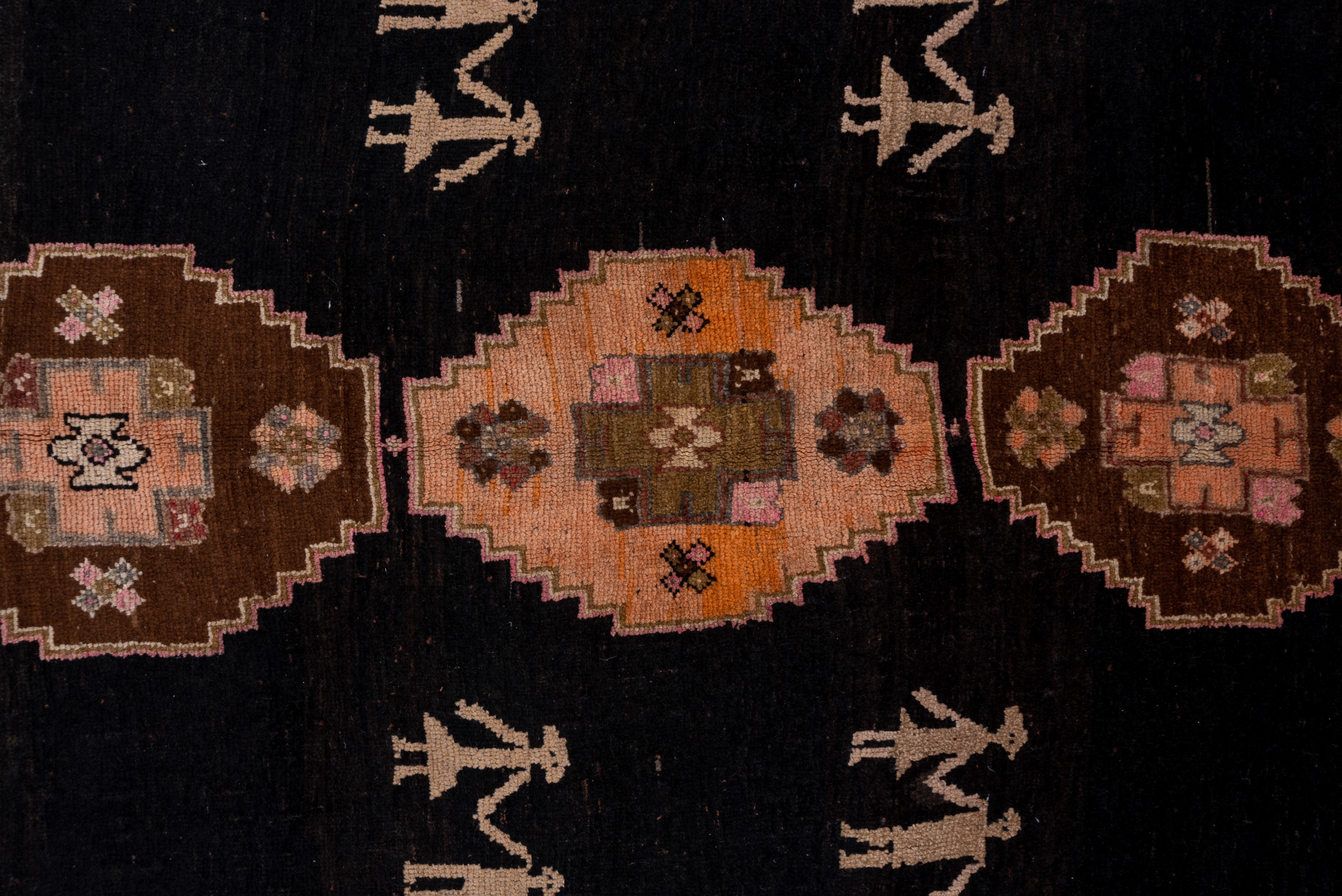 Tribal Antique Kars Rug, Black Field with Animal Motifs and People Motifs, Pink Accents For Sale