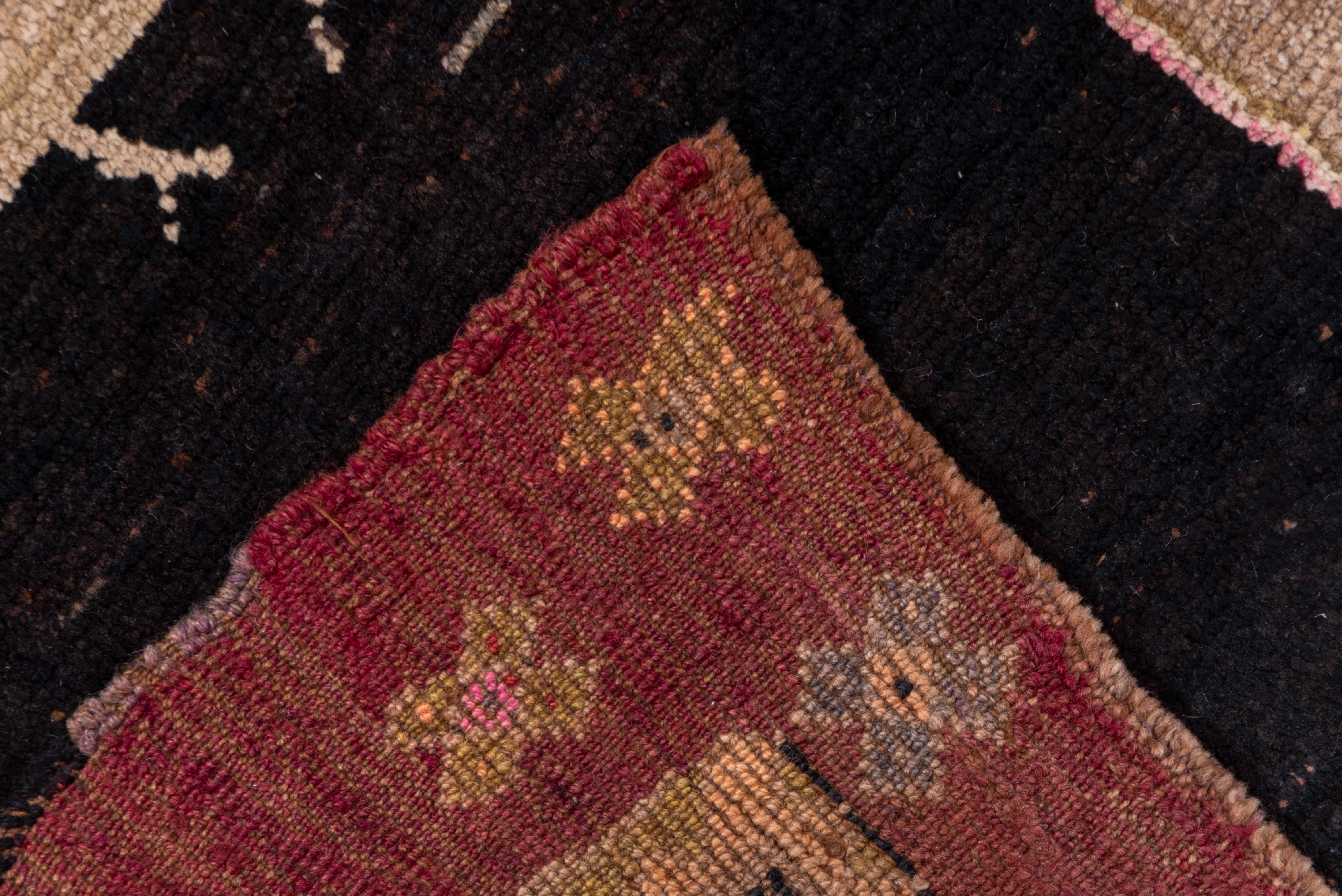 Antique Kars Rug, Black Field with Animal Motifs and People Motifs, Pink Accents In Good Condition For Sale In New York, NY