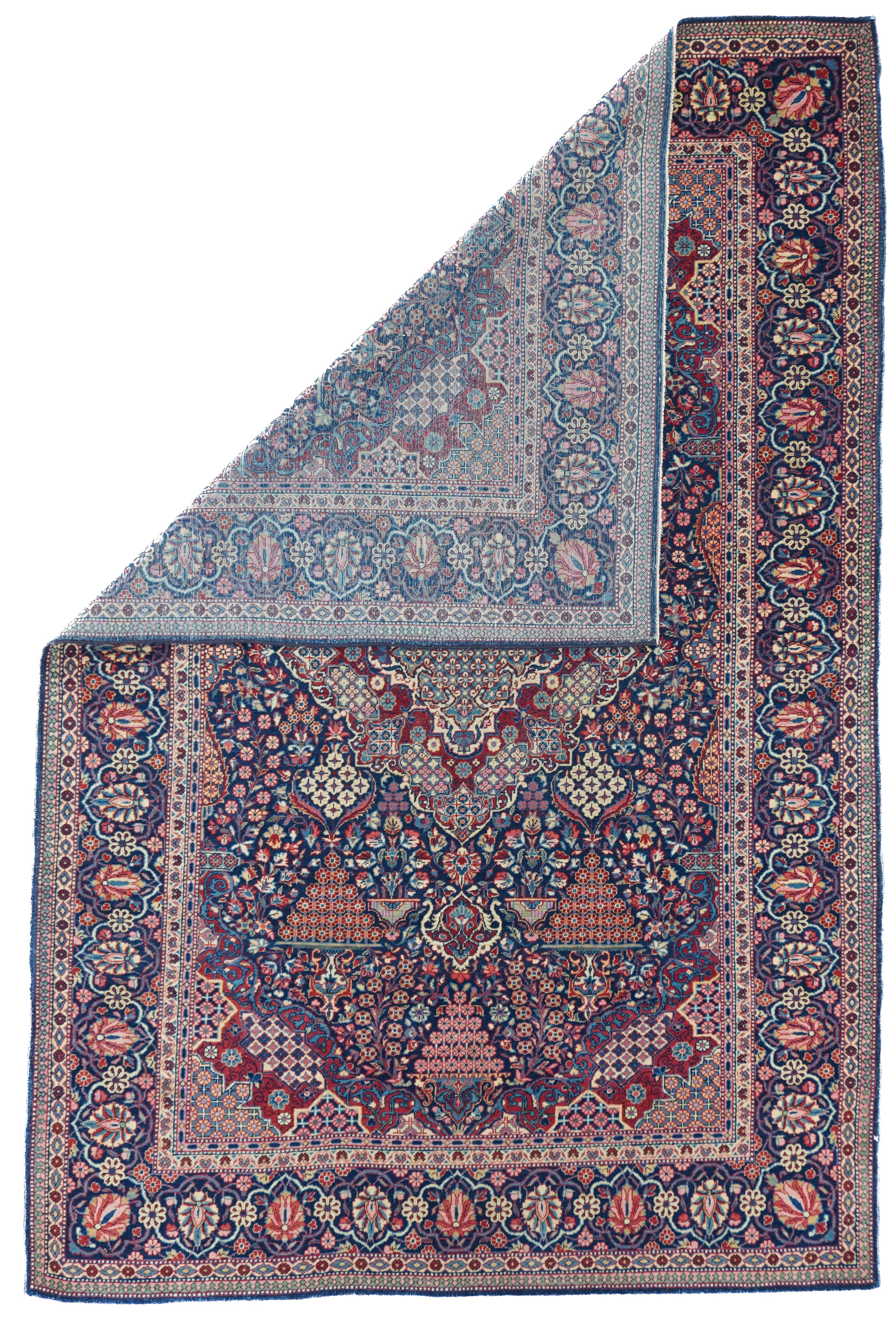 Antique Kashan Dabir rug measures 4'4'' x 6'8''. Finely woven with asymmetric (Persian) knots on a cotton foundation, this jewel-toned central Persian urban scatter shows a barbed diamond medallion in a millefleurs accented dark blue field with