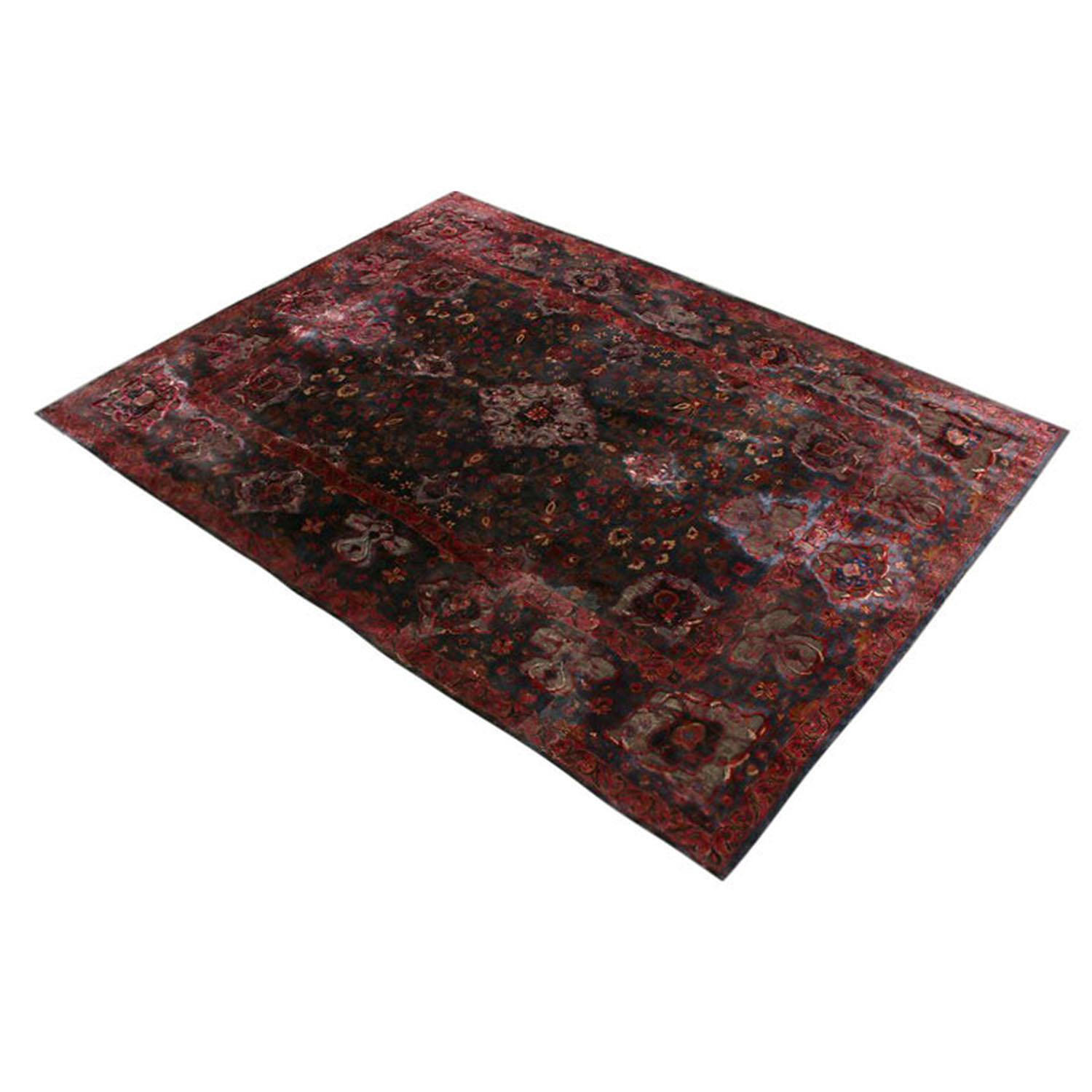 Hand knotted in Persia originating between 1910-1920, this antique Kashan rug presents distinct value in a marriage of appealing size, unique colorway and sheen metallic-silk blend complementing the rich notes of violet purple and blue. Further