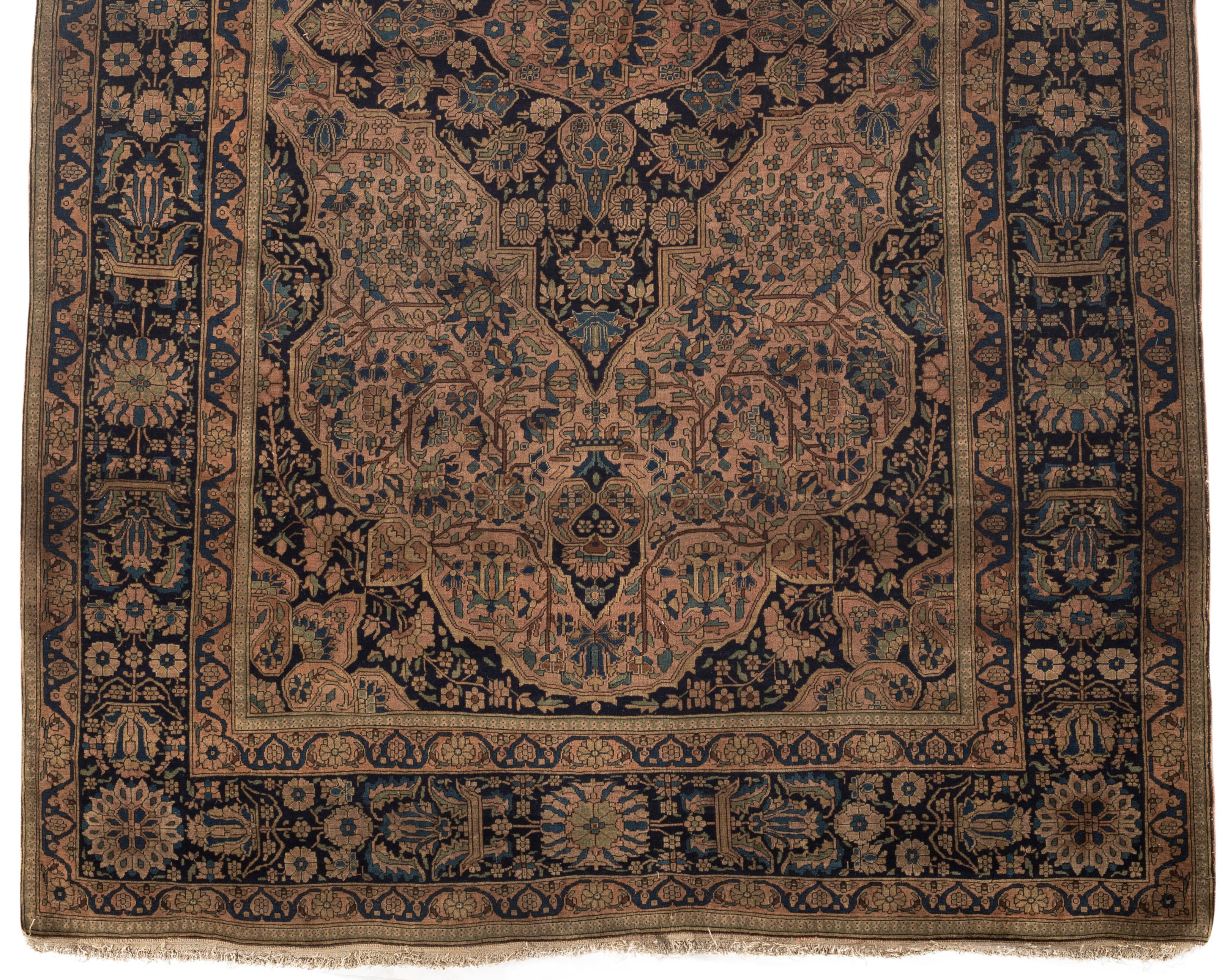 Antique Kashan Mohtashem Rose / Navy Rug, circa 1880. Mohtashem signifies the name of the master weaver whose works belong at the top of the highest category of rugs. In the later 19th century carpet weaving was revived by Hajji Mollah Hasan