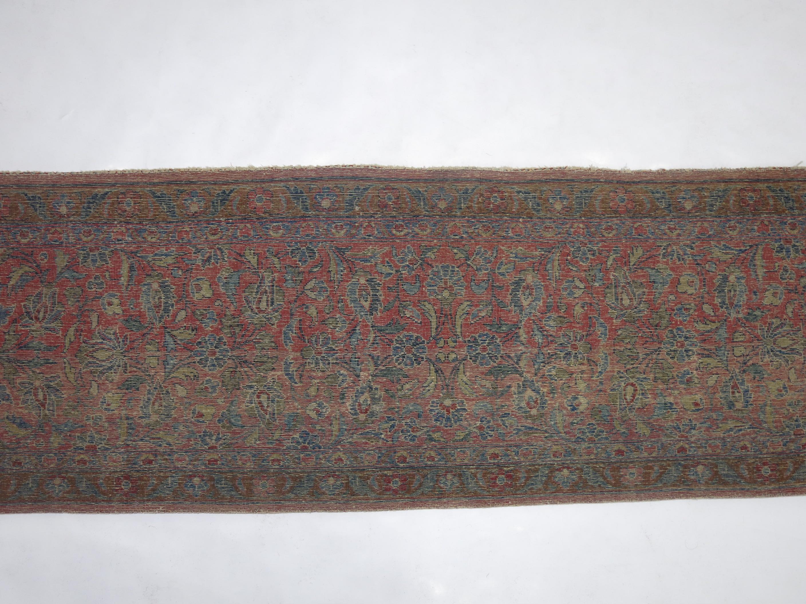 An early 20th century Persian Kashan small runner. Can also be used as a throw.