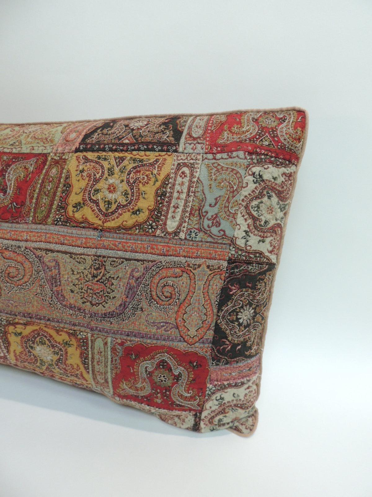 Antique Kashmir patchwork paisley long bolster decorative pillow.
Decorative pillow in shades of red, green, yellow, black and brown. Decorative pillow handcrafted and designed in the USA. Closure by stitch (no zipper closure) with custom made