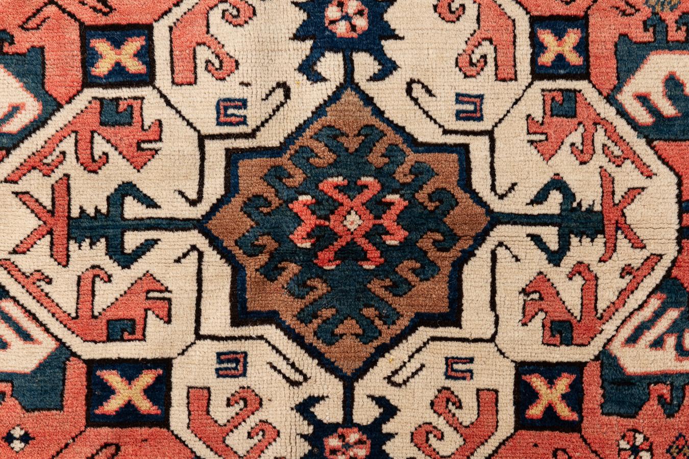 Kassim Ushag – Karabagh, South Caucasus

This stunning Kassim Ushag is unique due to the use of vibrant colours, which are rarely found in this type of rug. With an asymmetrical geometric design, it has an octagonal medallion in ivory colour. The