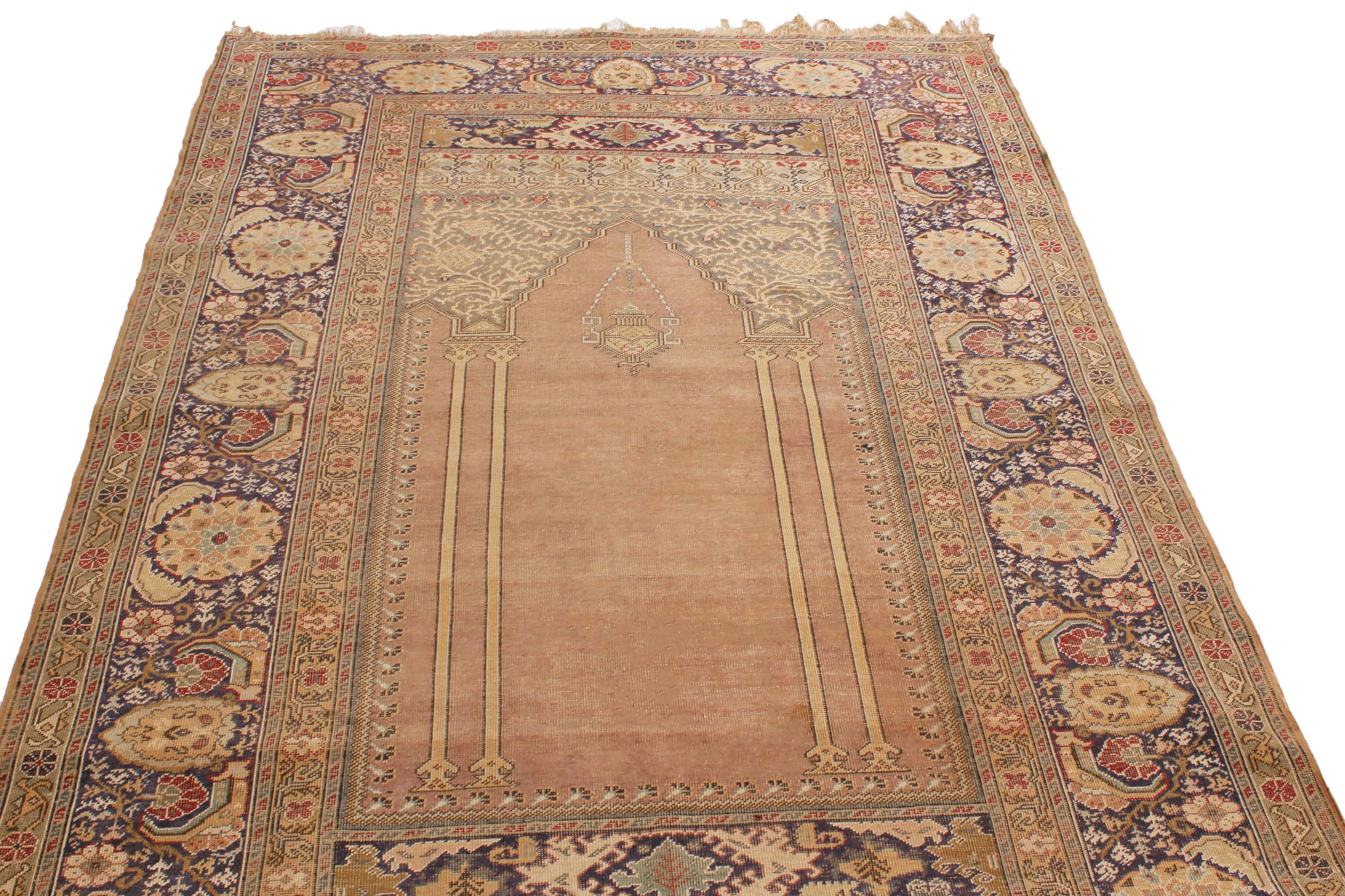 Enjoying hand knotted wool originating from Turkey in 1900, this turn of the century antique Kayseri rug utilizes one of the most distinguished, sharply woven mihrab gateway designs to complement its unique size and colourways. Featuring a bold