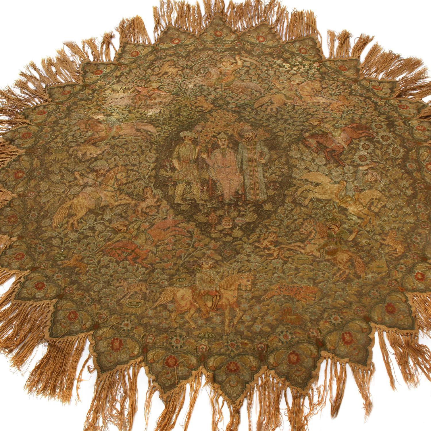 Hand knotted in Turkey between 1880-1890, this antique metallic Kayseri circle rug enjoys a spacious but inviting toothed guard design, complemented by tasseled fringes highlighting the finesse of the inner pattern and its crimson red accents as