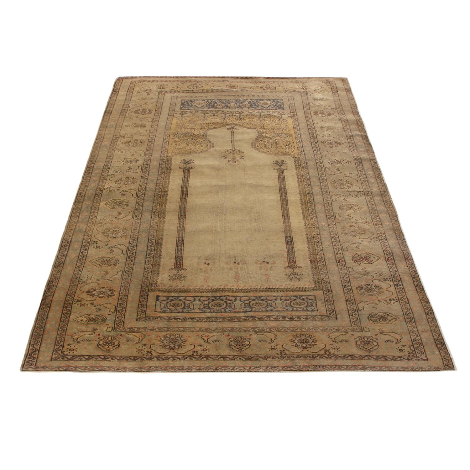 Hand knotted in high-quality wool originating from Turkey in 1870, this antique Kayseri rug enjoys an inviting, luminous shade of beige complementing more vibrant golden-yellow and blue accents, balancing the visual gravity of the central Mihrab