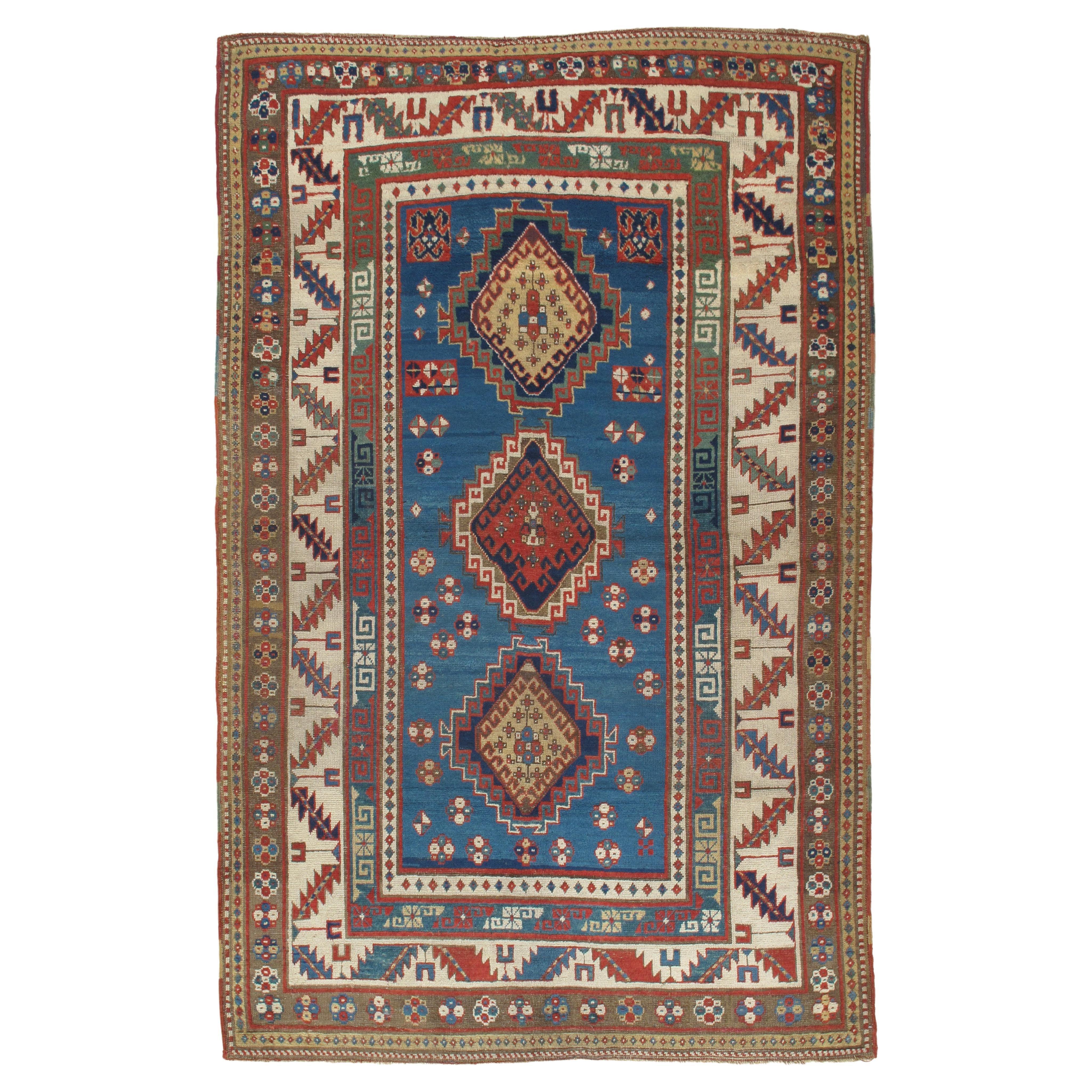 Antiker Kazak-Teppich, handgefertigt, Wolle, Rost, Elfenbein, Marineblau, Hellblau und Gold