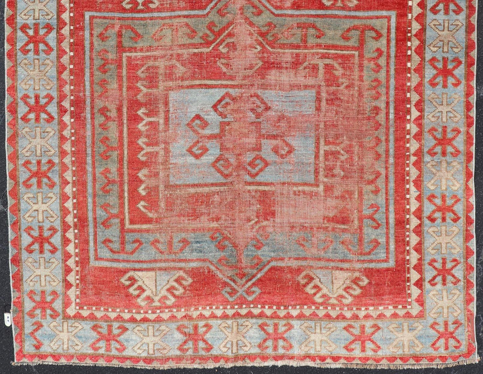 Hand-Knotted Antique Kazak Caucasian Distressed Rug with Geometric Double Medallion Design  For Sale