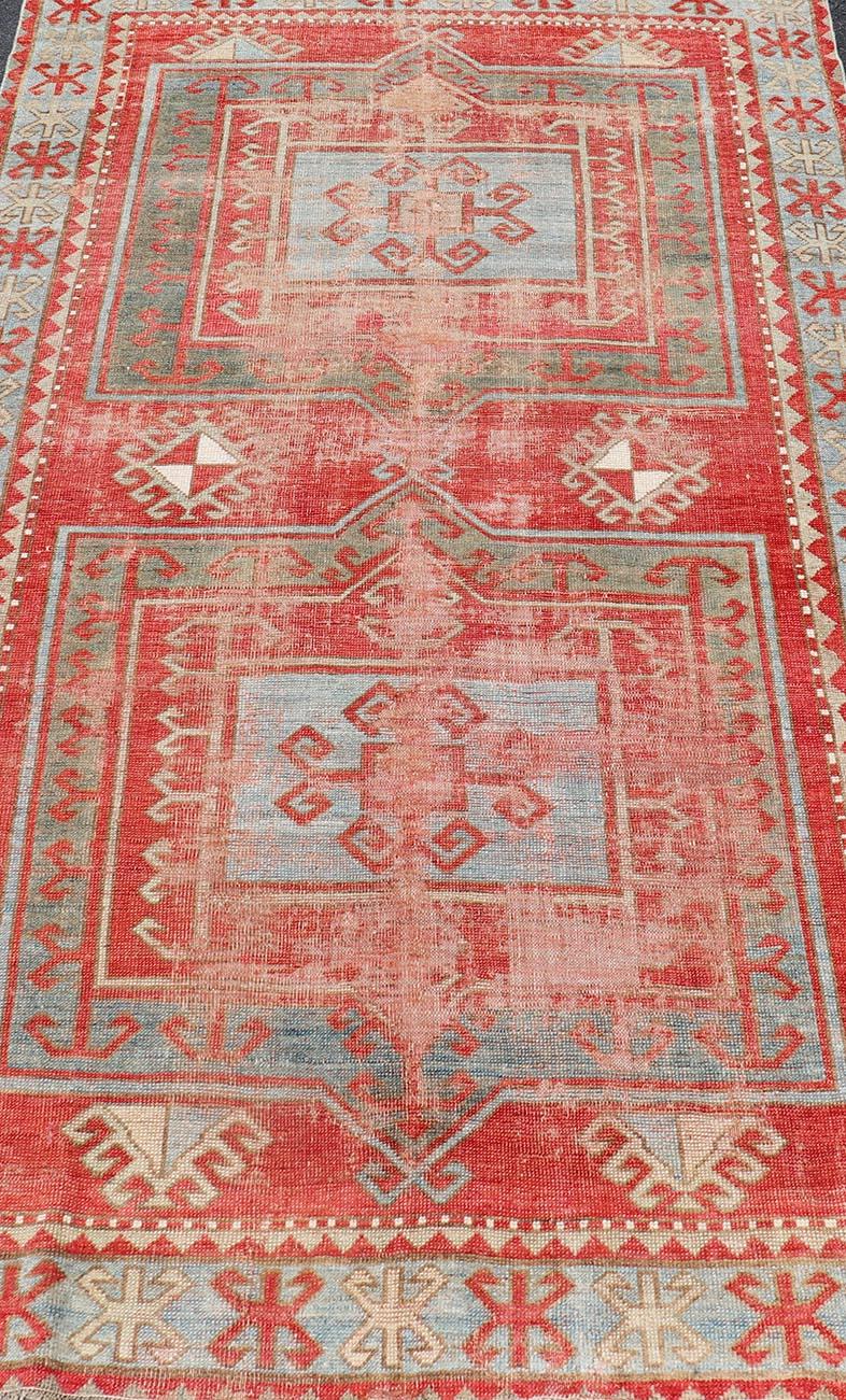 Early 20th Century Antique Kazak Caucasian Distressed Rug with Geometric Double Medallion Design  For Sale