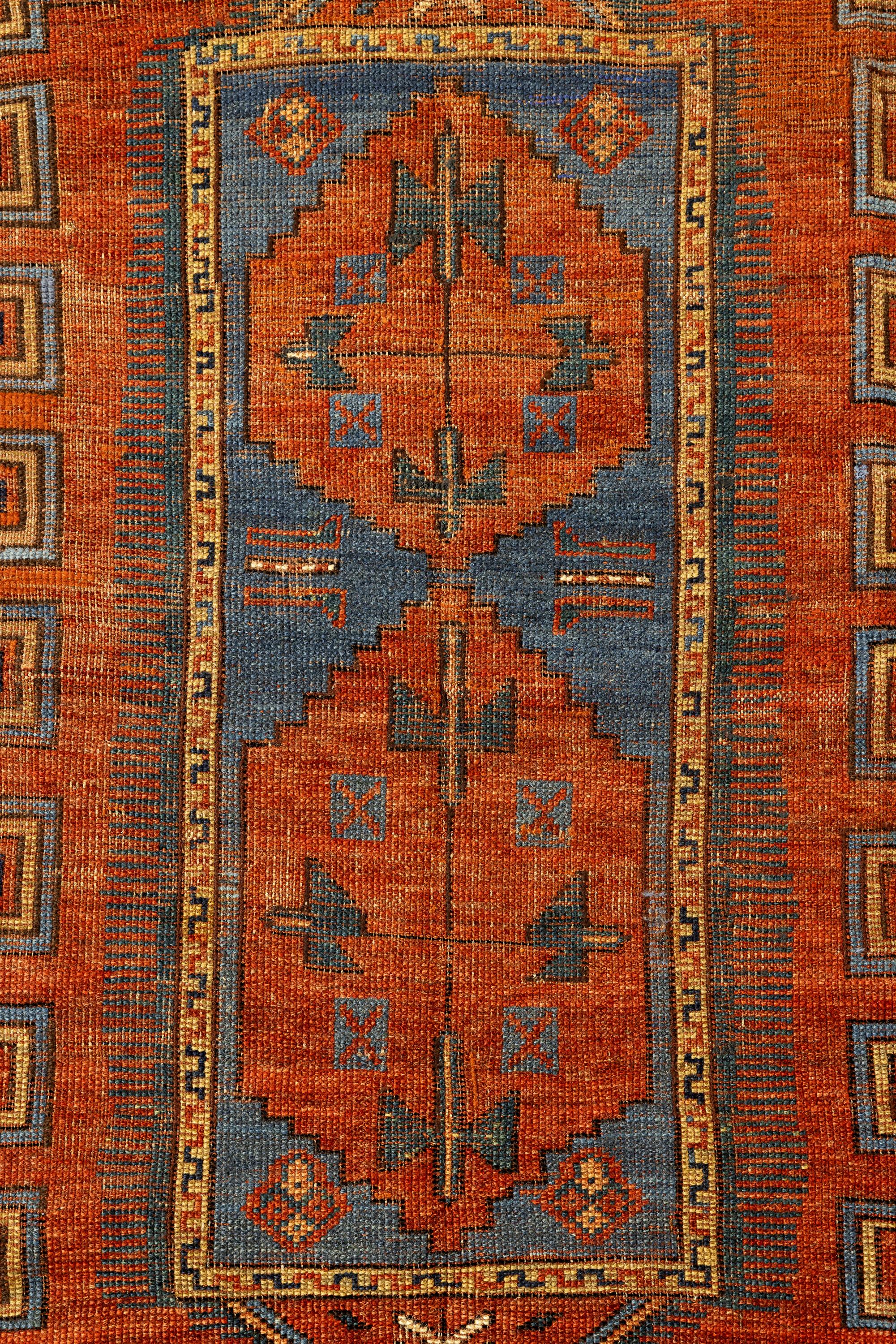 Kazak – Central Caucasus

The central field has a rectangle with two asymmetrical medallions, which in turn is protected by a long octagonal medallion in the shape of a zigzag, a standard feature of this rug. Four diamonds are arranged in each rug