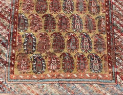 Antique Kazak Caucasian Short Runner with Paisley Design On Gold Background