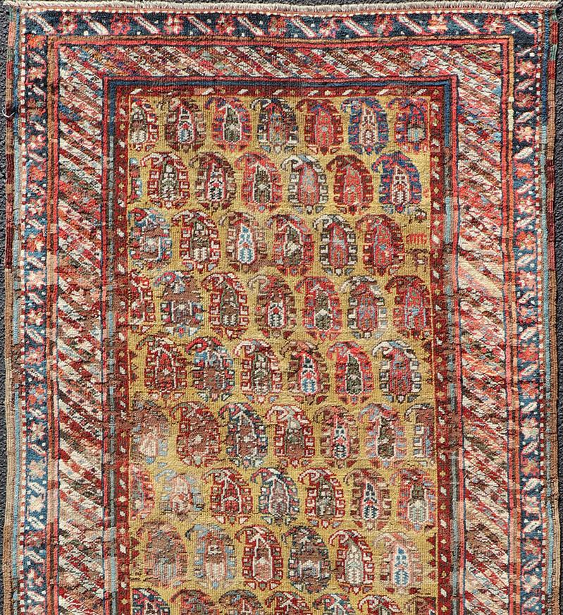 Hand-Knotted Antique Kazak Caucasian Short Runner with Paisley Design On Gold Background For Sale