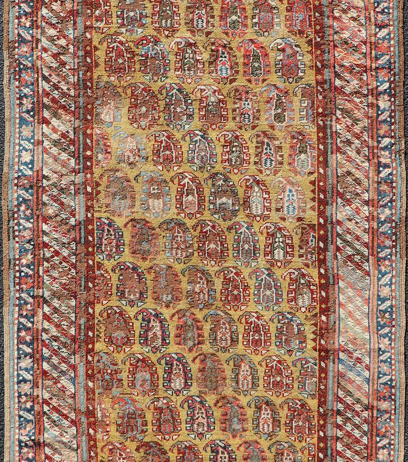 Antique Kazak Caucasian Short Runner with Paisley Design On Gold Background In Good Condition For Sale In Atlanta, GA