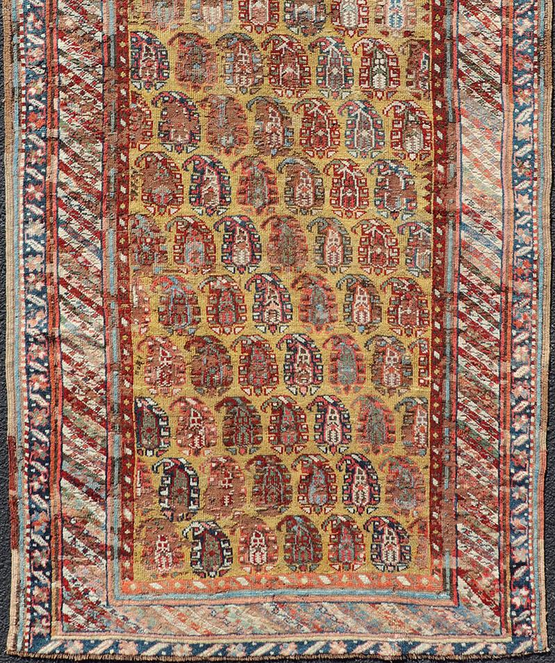 Late 19th Century Antique Kazak Caucasian Short Runner with Paisley Design On Gold Background For Sale