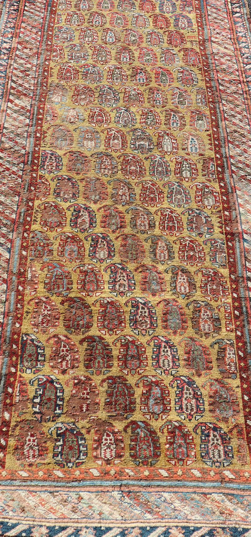 Wool Antique Kazak Caucasian Short Runner with Paisley Design On Gold Background For Sale