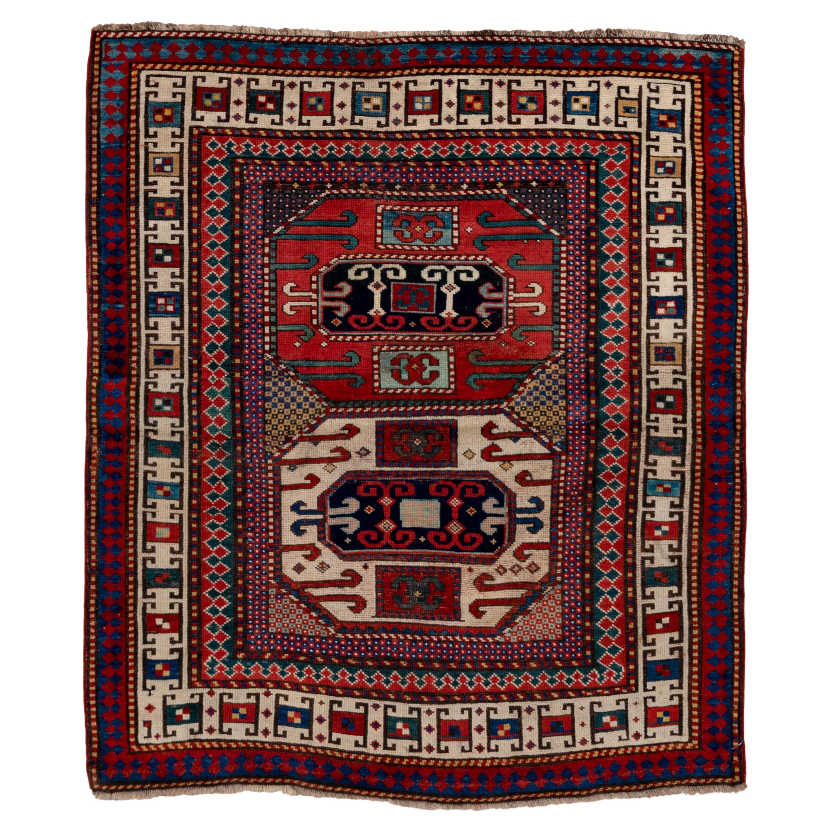 Antique Kazak in Red and Ivory with Tribal Detailing - Circa 1900s For Sale