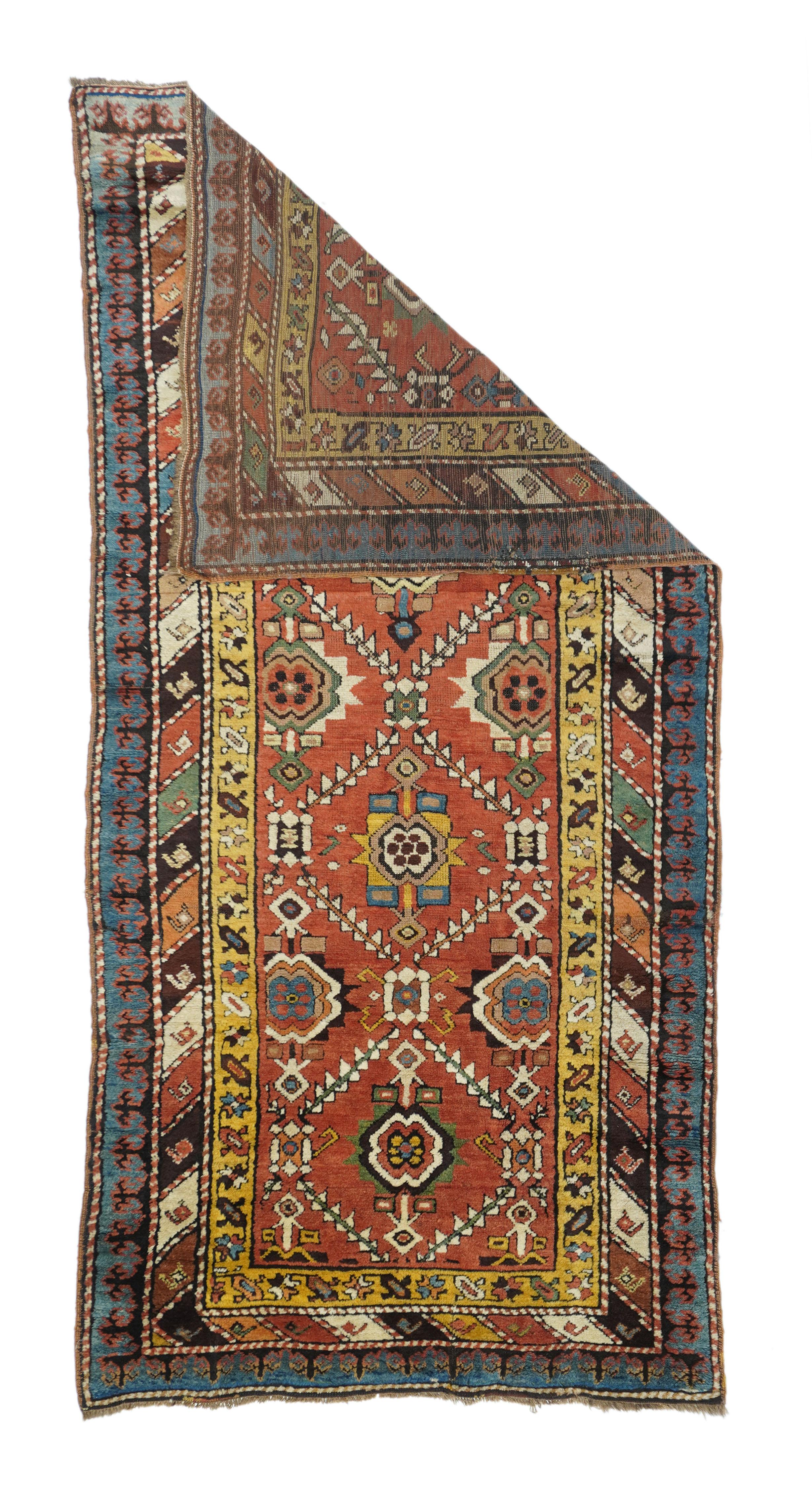 Antique Kazak Rug 3'8'' x 8'1''. With a warm madder red field divided evenly by a doubly stepped lattice into reserves centred by pinched octagonal elements. An allover textile pattern. Color diagonal stripe middle border and bitonal keyhole