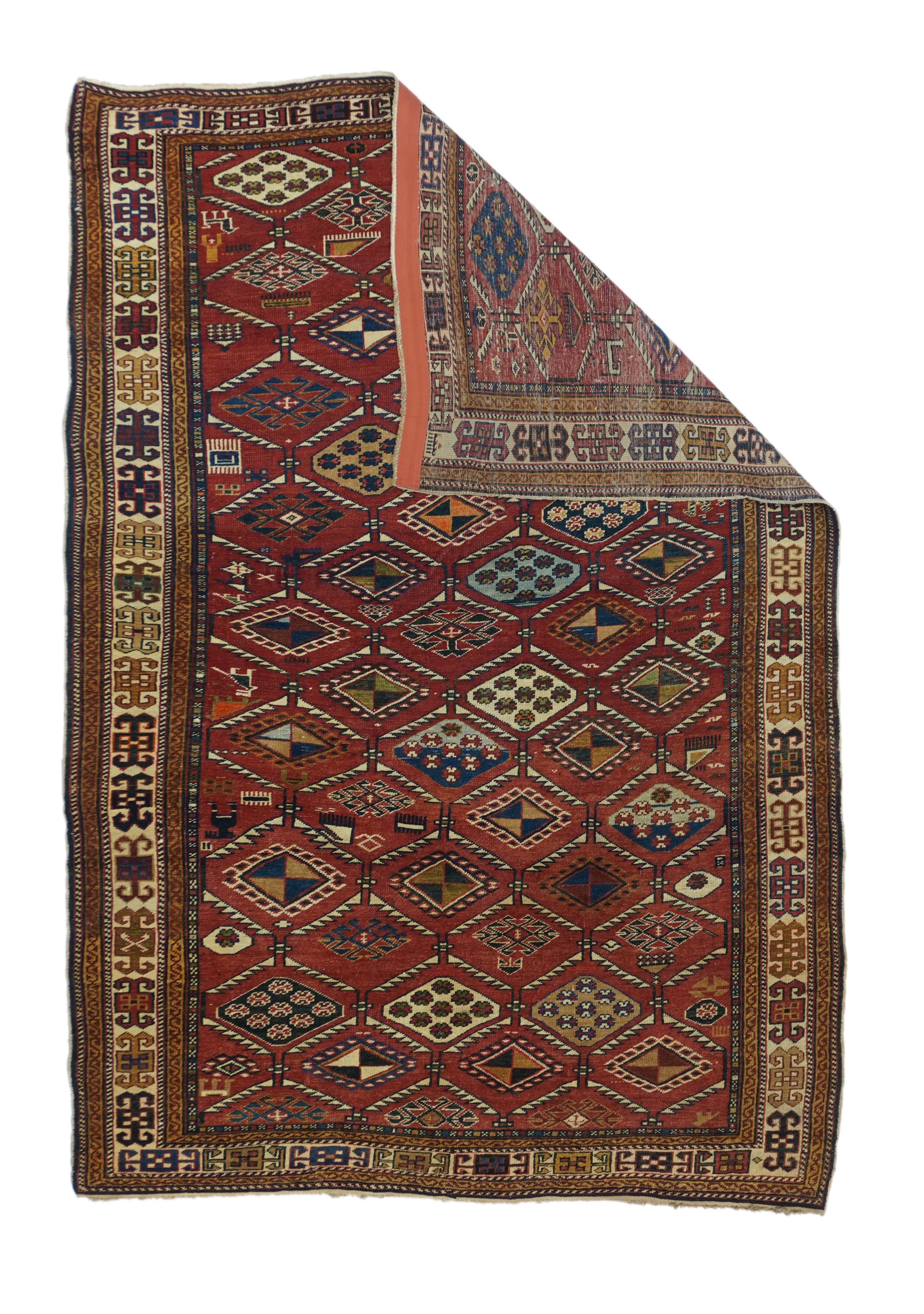 Antique Kazak rug measures: 4'1'' x 6'2''.