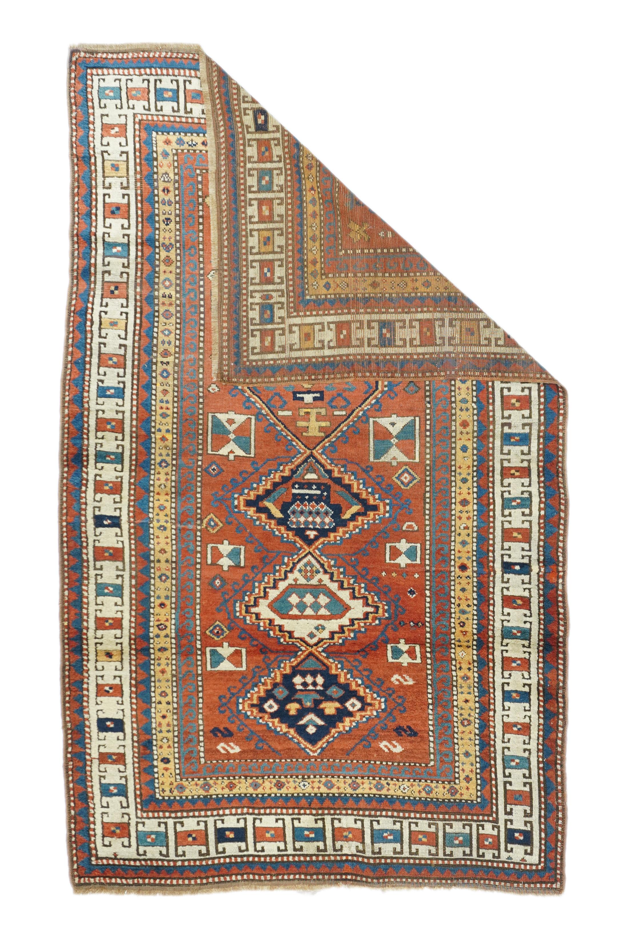 Antique Kazak rug measures: 4'1'' x 7'1''.