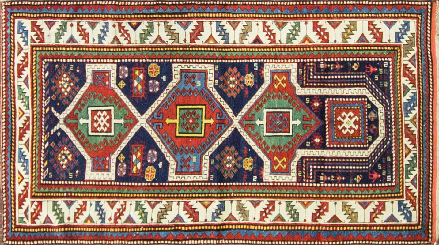 Kazak rugs are primarily produced as village productions rather than city pieces. Made from materials particular to individual tribal provinces, the rugs of the Caucasus normally display bold geometric designs in primary colors. Kazak rugs are a