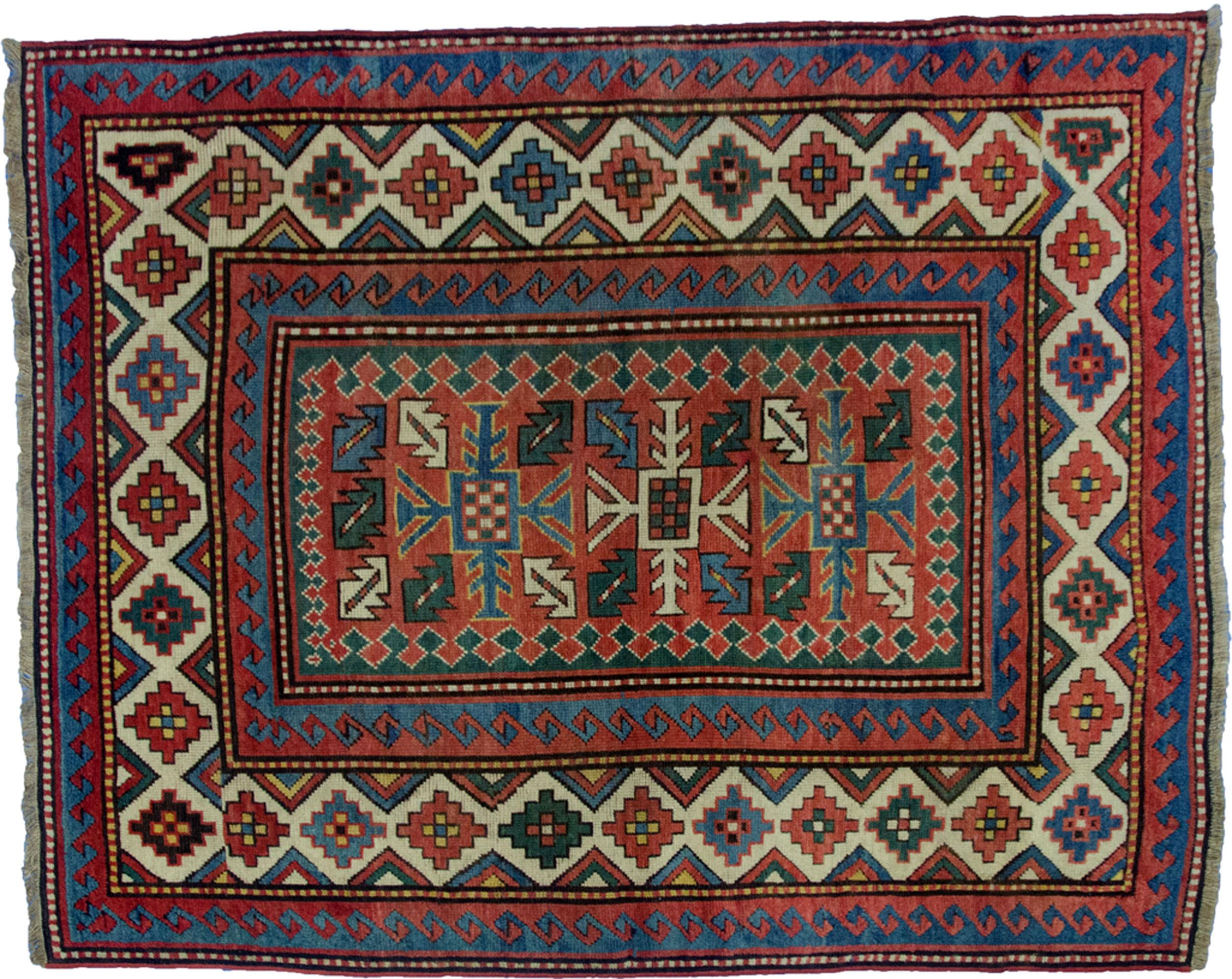 Attractive antique Kazak rug. Triple cross medallion with a stylised leaf in each quarter on a soft red background, hooked guard borders and a very pretty cream geometric border. 
Size: 6x5 ft 190x150 cm.
