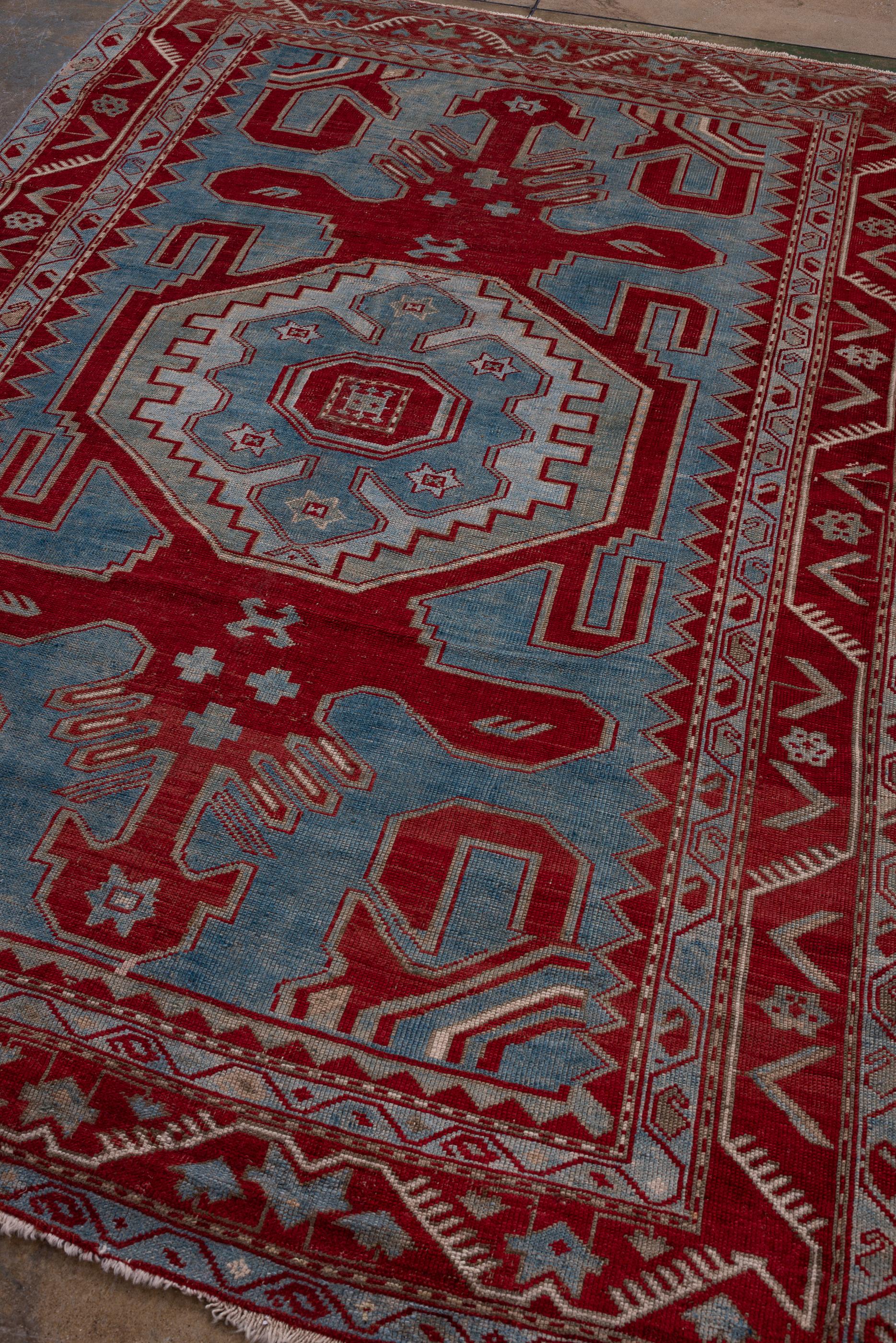 Azerbaijani Antique Kazak Rug with Bold Red Border and Blue Field