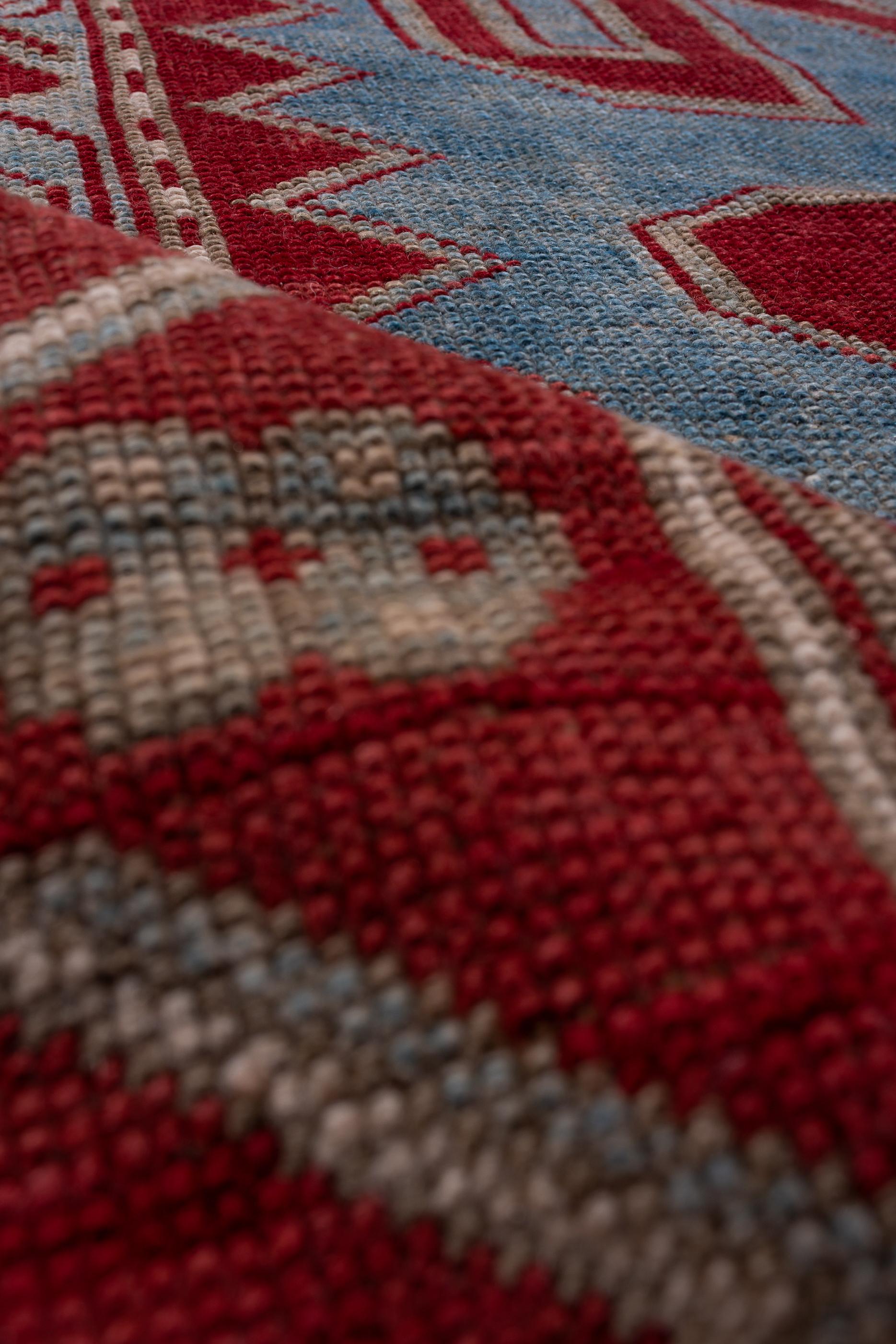 Wool Antique Kazak Rug with Bold Red Border and Blue Field