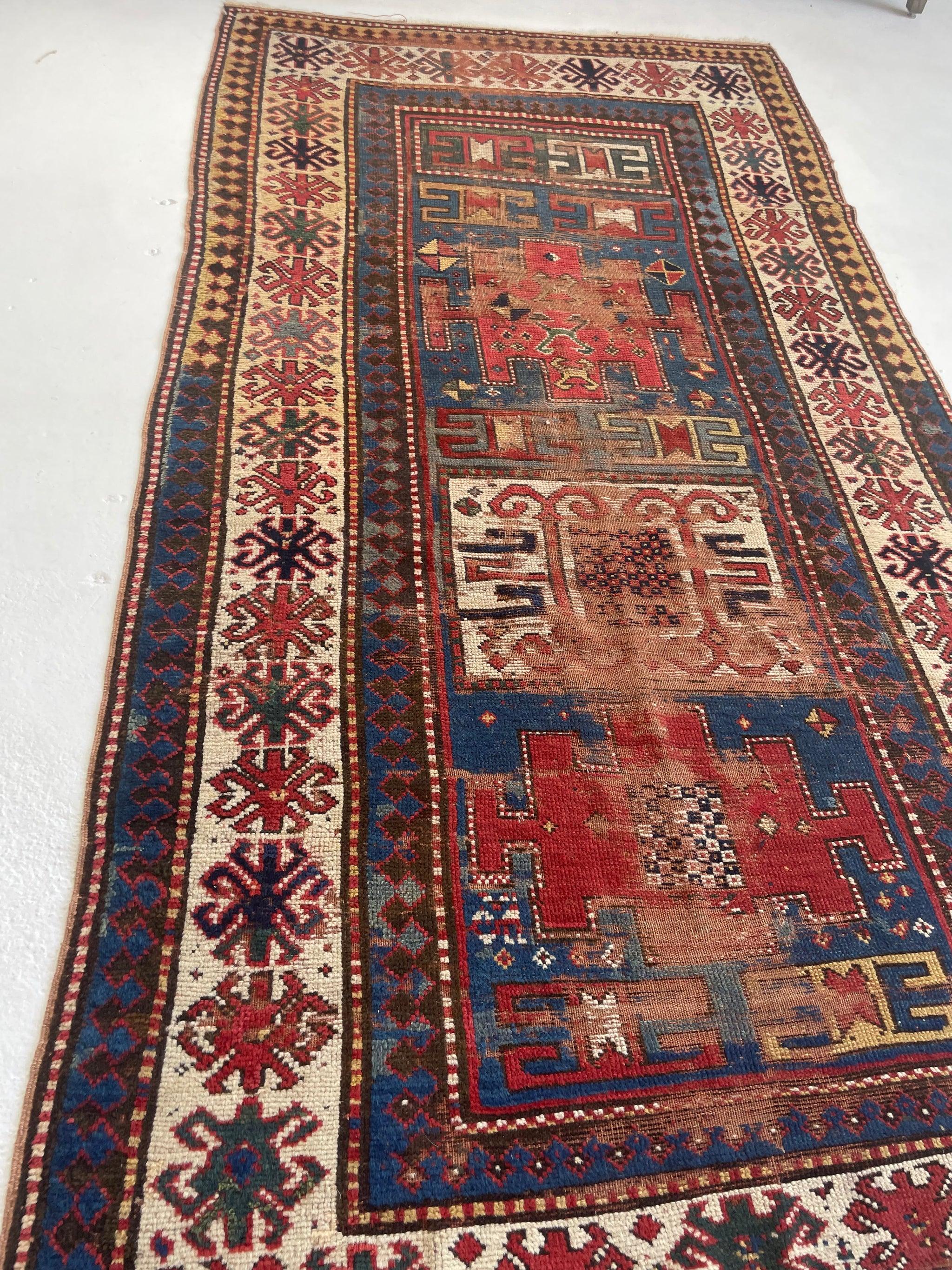 Antique Kazak Rug with Iconic Fence of Protection Perimeter, c. 1920-30's In Good Condition For Sale In Milwaukee, WI