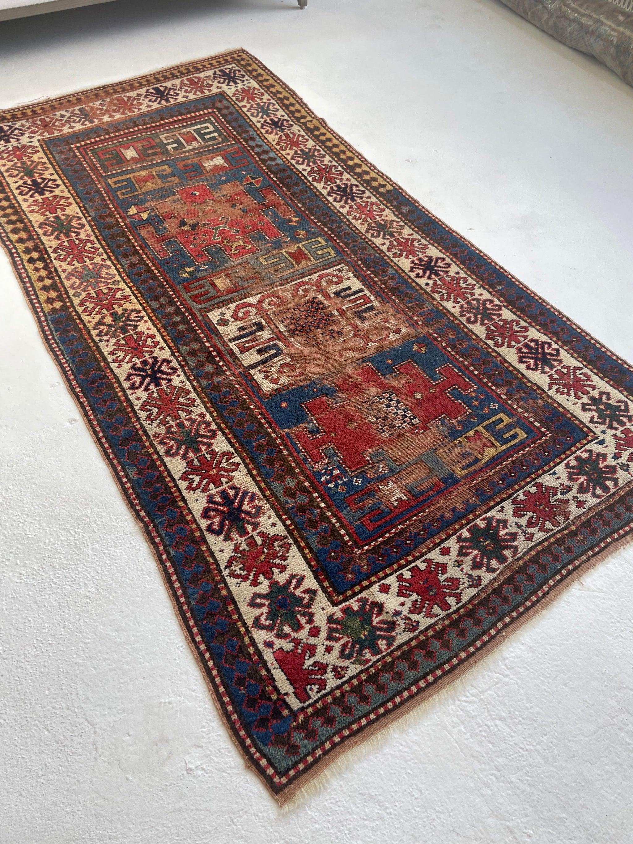 20th Century Antique Kazak Rug with Iconic Fence of Protection Perimeter, c. 1920-30's For Sale