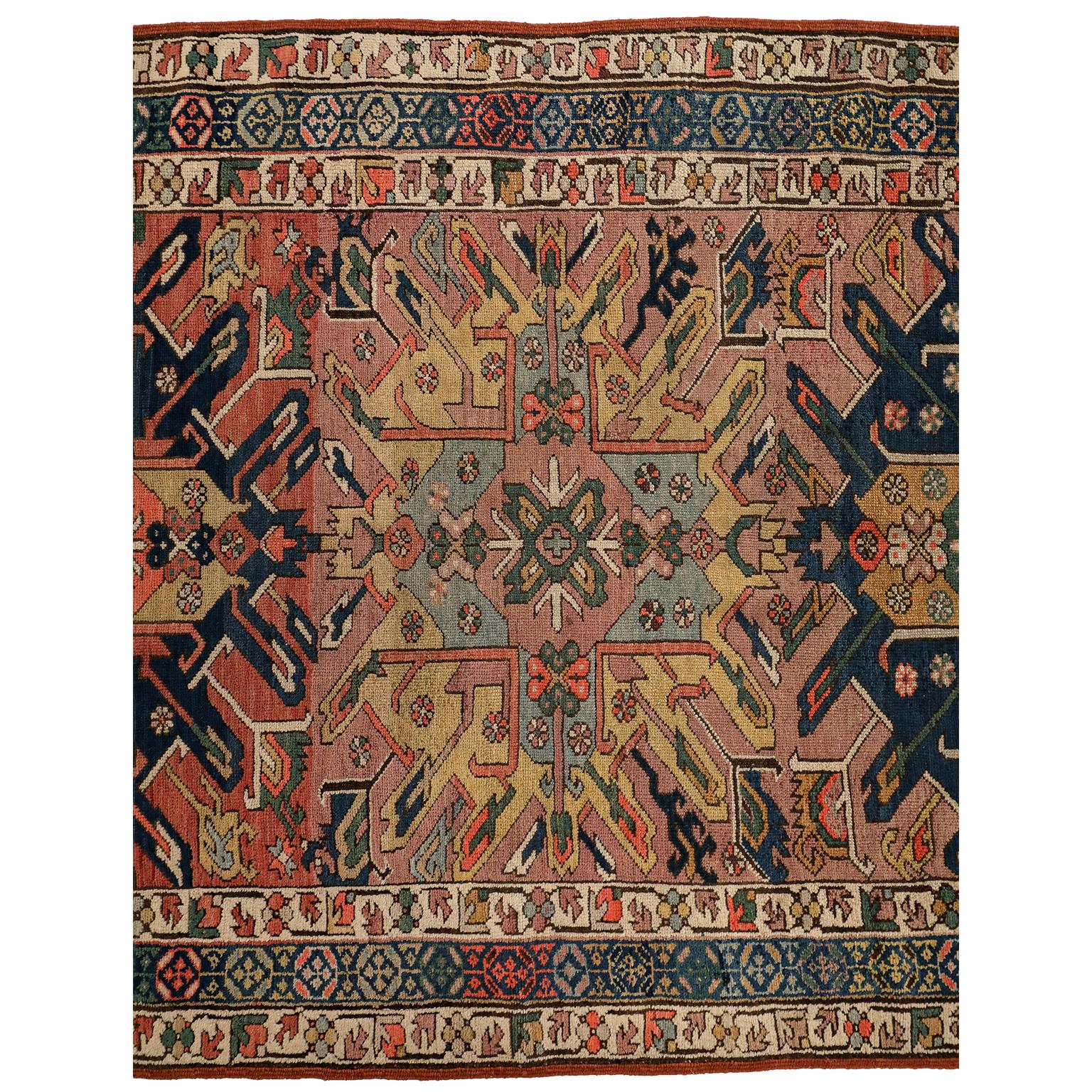 This antique Kazak runner circa 1880 in pure handspun wool and vegetable dyes features a central garden design composed of five four-part medallions. Its geometric composition achieves an organic fluidity through its floral motifs and sophisticated