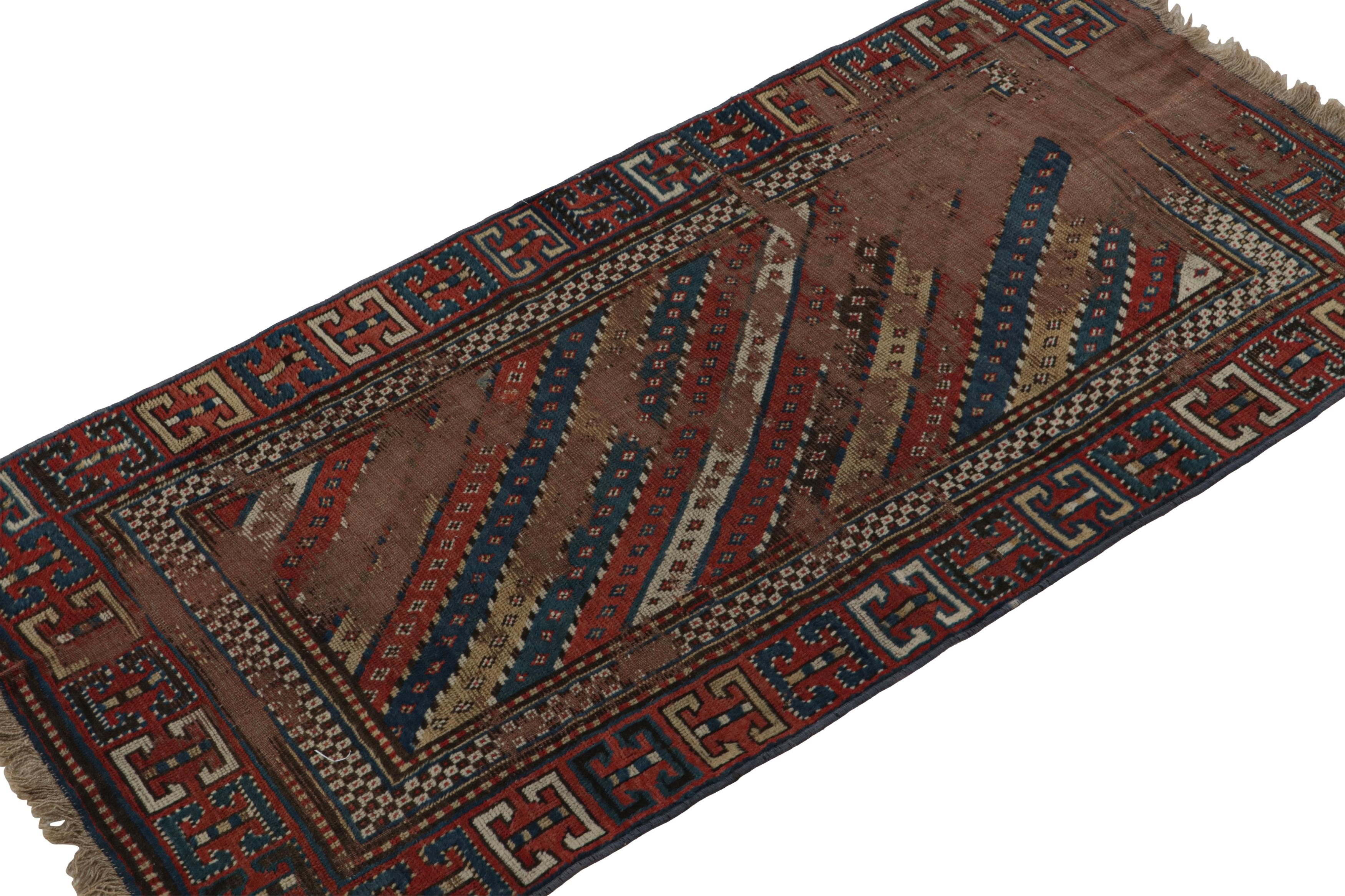 Hand-knotted in wool and hailing from Russia circa 1910-1920, this 3x6 antique Kazak runner rug is a rare Caucasian tribal curation from the collection by Rug & Kilim.  

On the Design:

This piece enjoys primitivist geometric patterns in brick red,