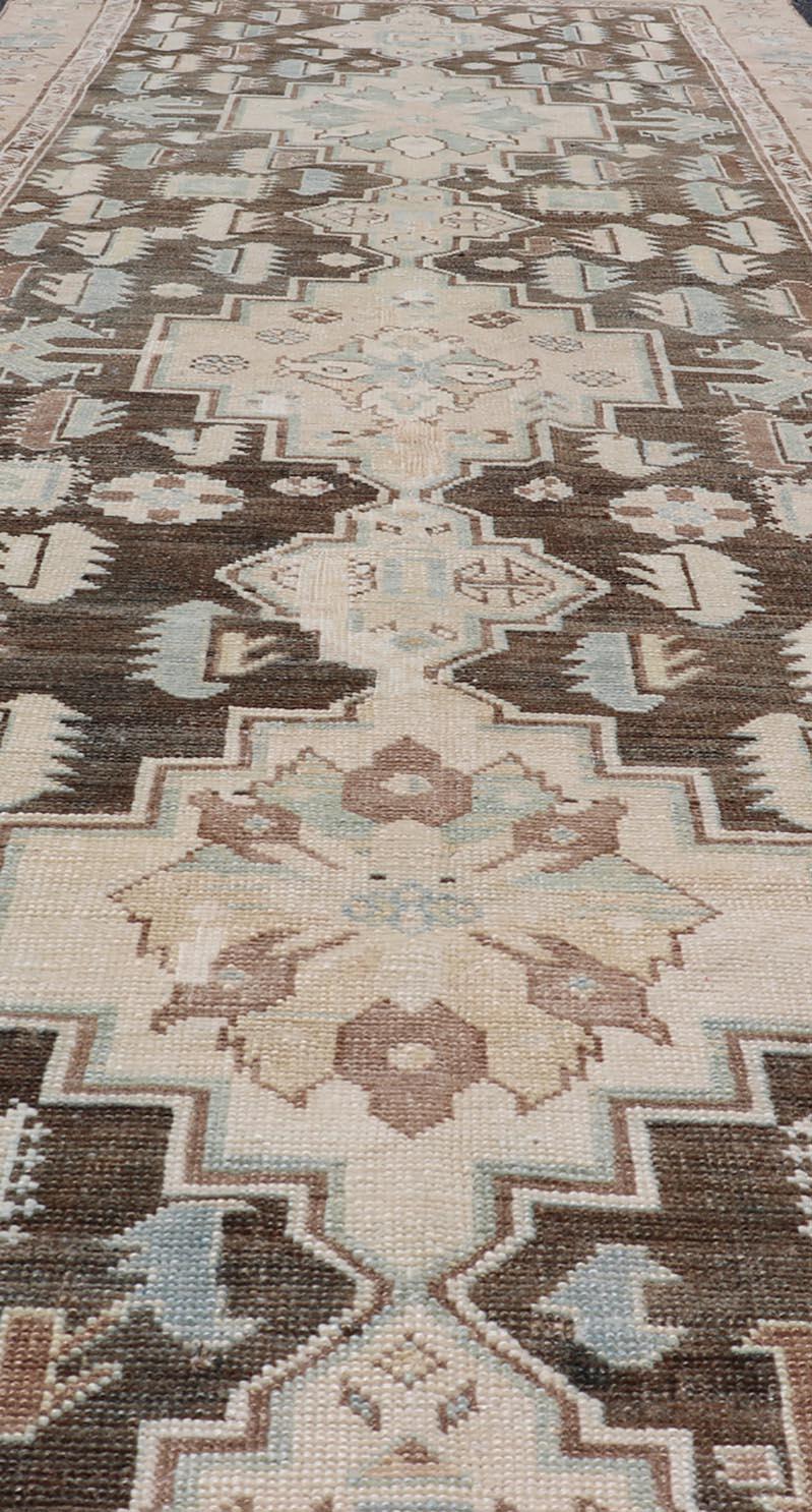 20th Century Antique Kazak Runner with Geometric Design and Medallions on a Brown Field
