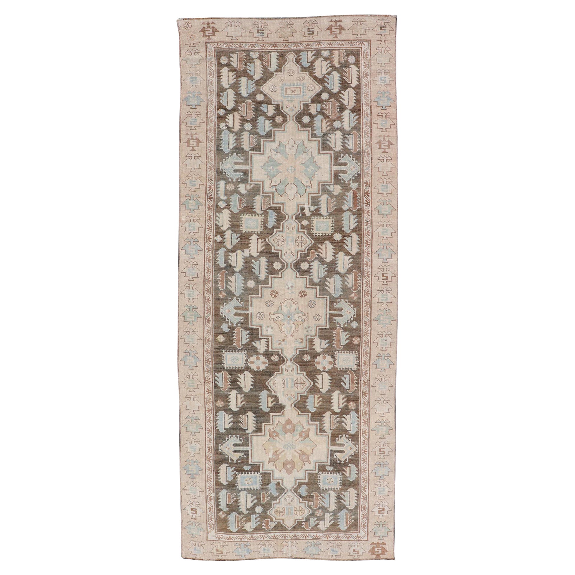 Antique Kazak Runner with Geometric Design and Medallions on a Brown Field For Sale