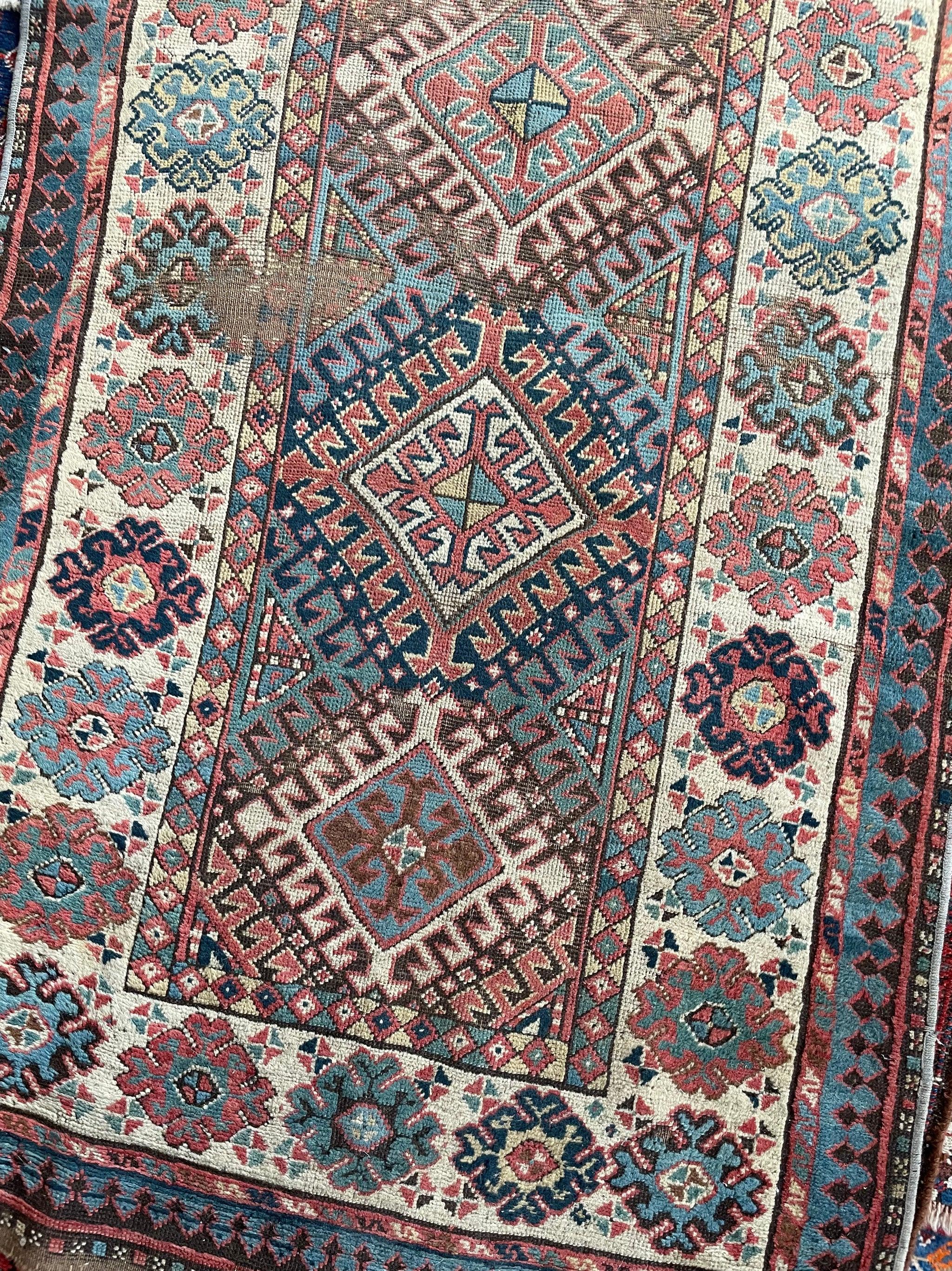 Fantastic Antique Kazak Runner  Tribal Beauty with Mature Dyes & Iconic Design  

About: Look at this Size!! The Notorious old and beautiful in the Highly desirable 10 foot long length!! Perfect for a kitchen, wider hallway, foyer, bedside, and