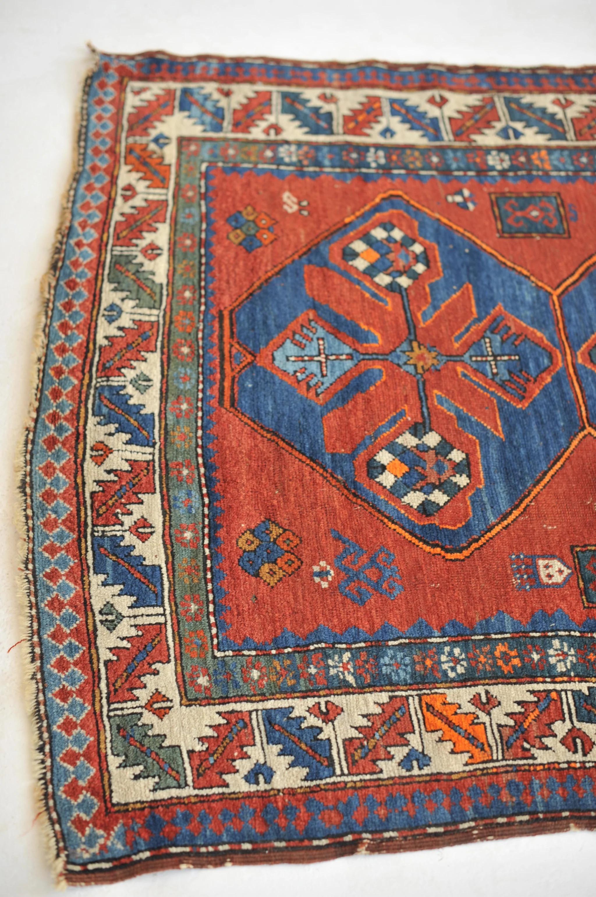 Antique Kazak with Variations of Clay, Rust, Autumn with Animals and Denim Blue

Size: 4.5 x 7.5
Age: Antique
Pile: Low with age-related patina.

This rug is one-of-a-kind, only one in the world, no others are available.

Because of the nature and